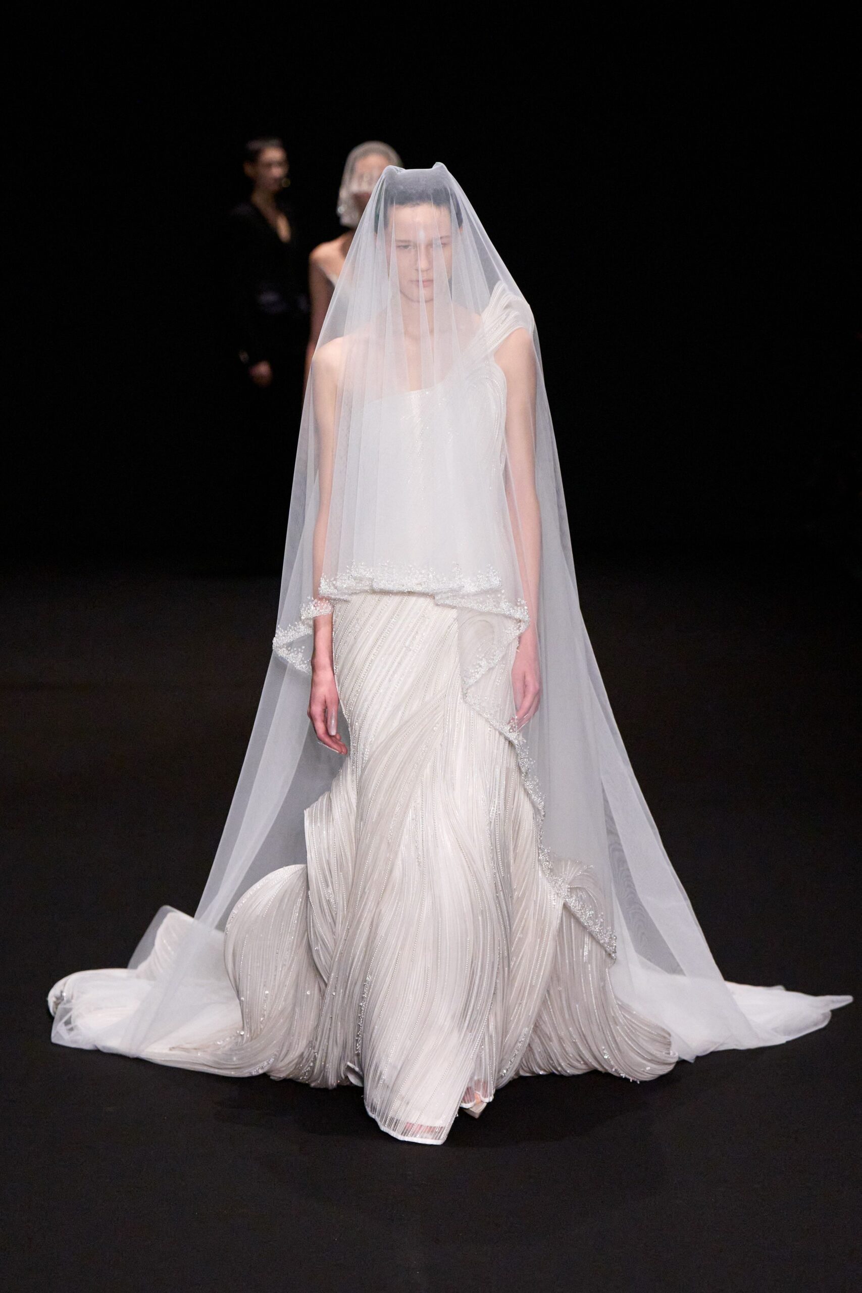 white silk pleated gown with veil