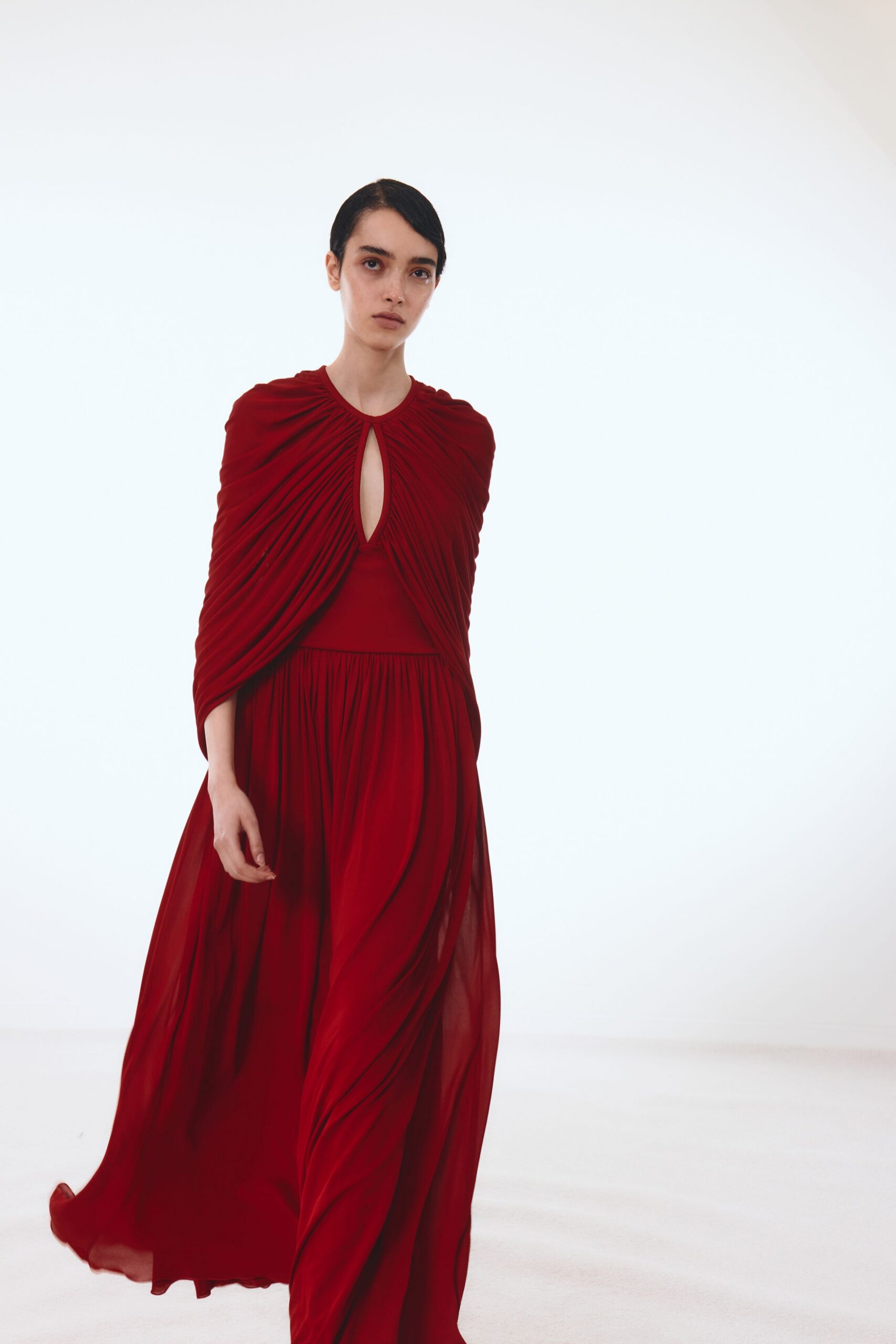 red flowing sleeveless gown