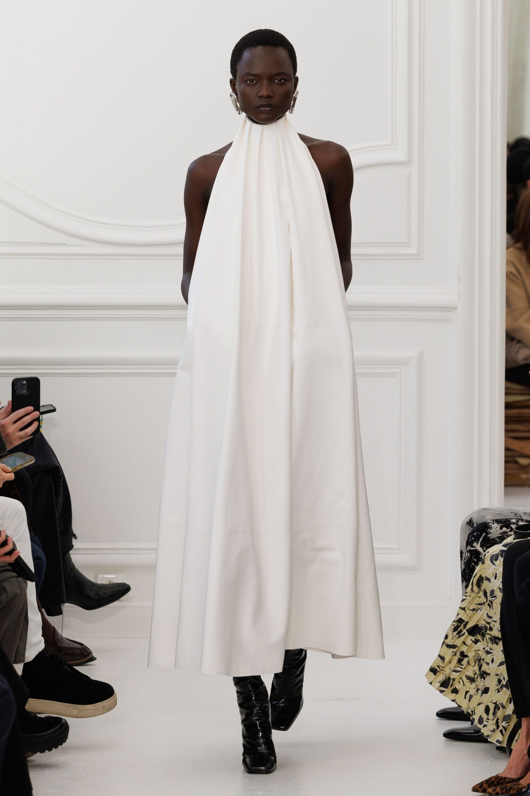 white silk draped gown with black boots