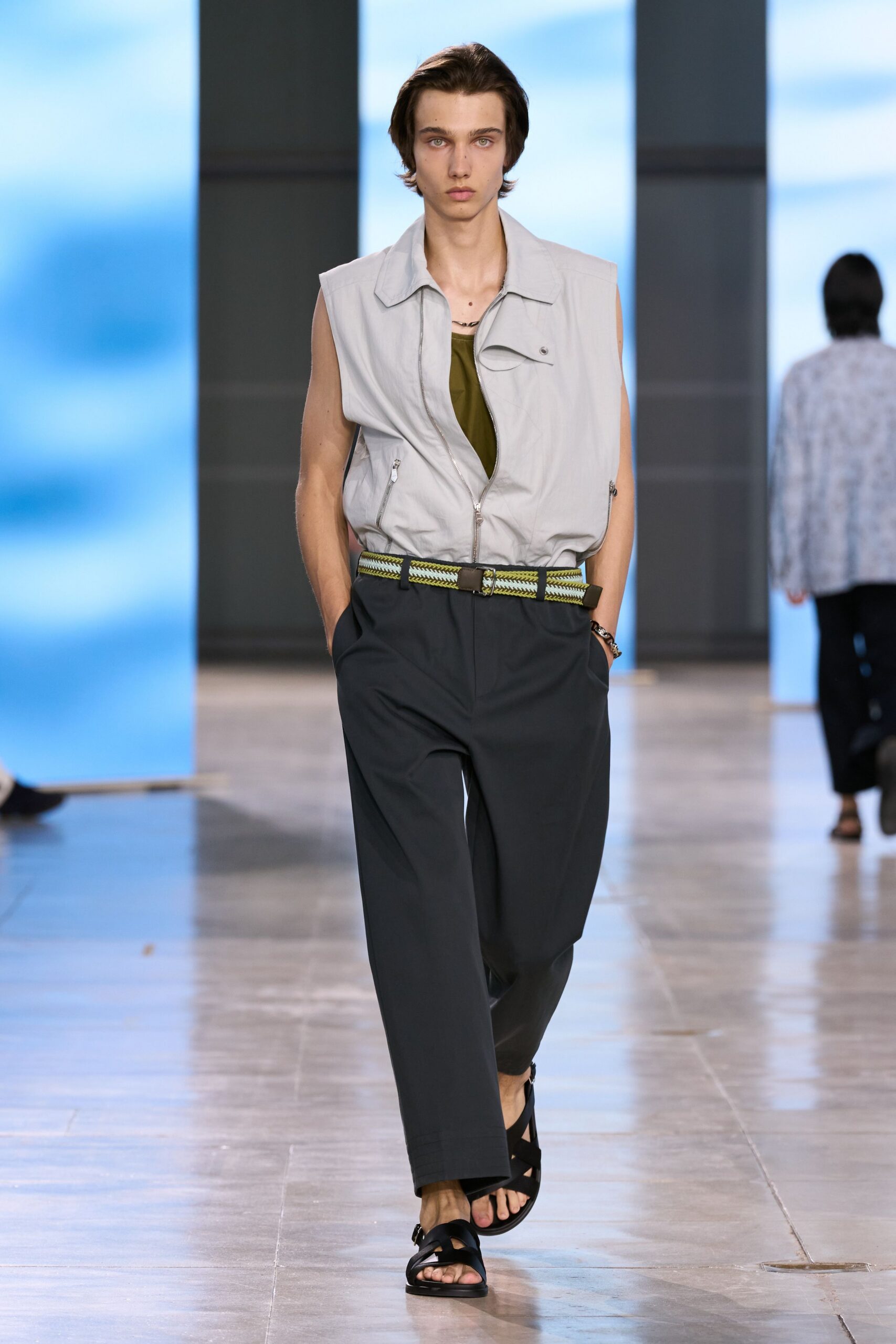 gray vest with black pants