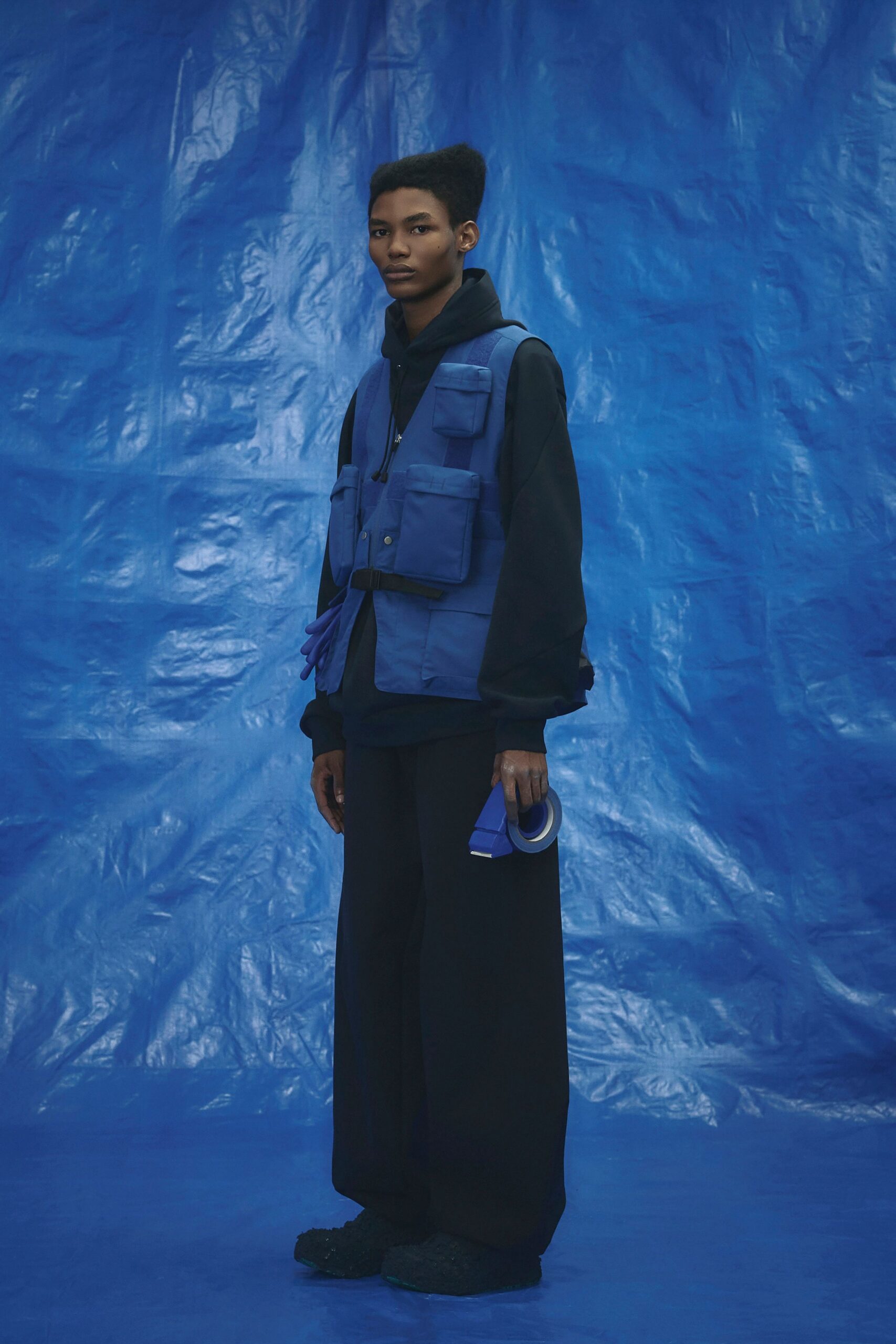 blue vest black hoodie relaxed outfit