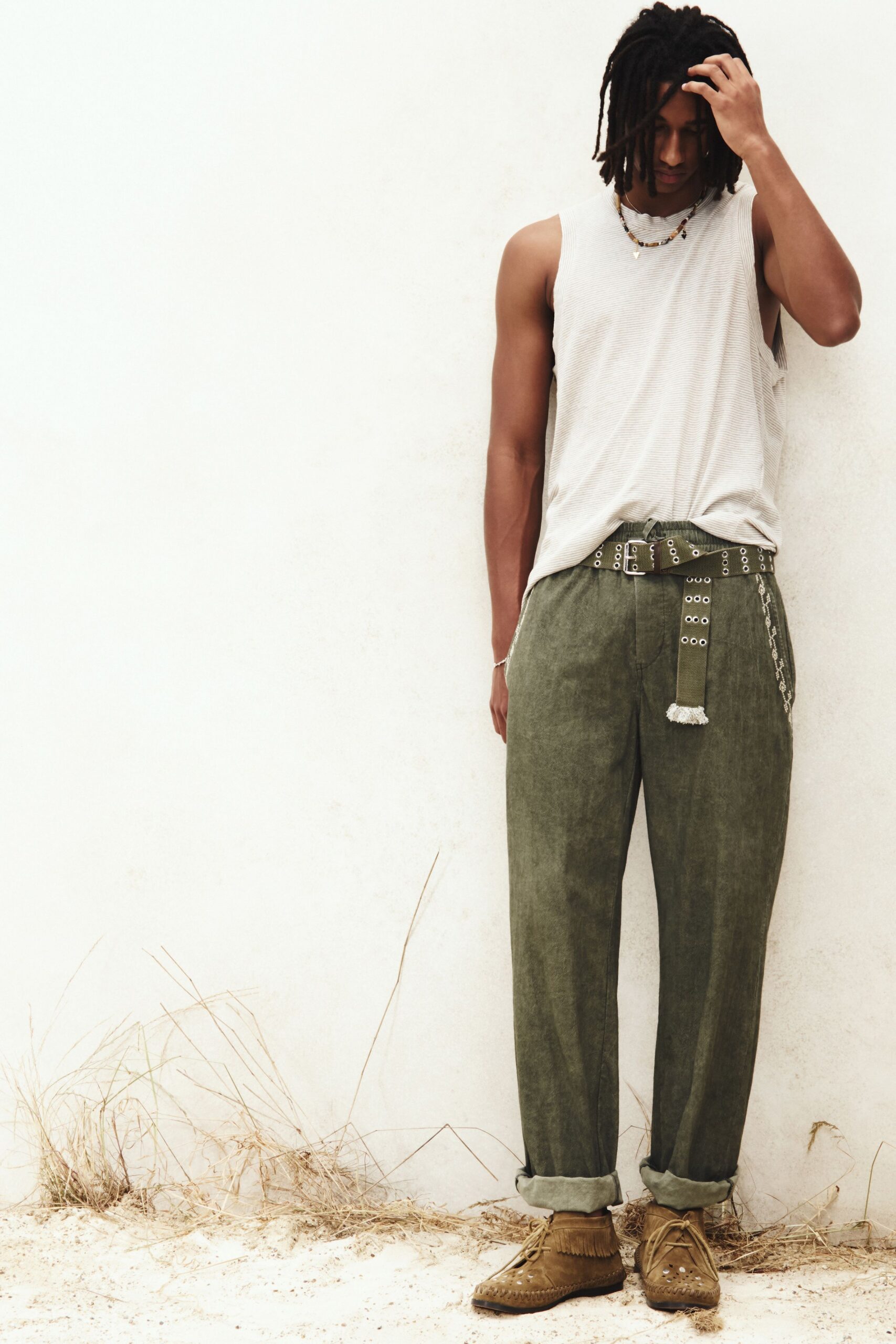 gray tank-top green pants