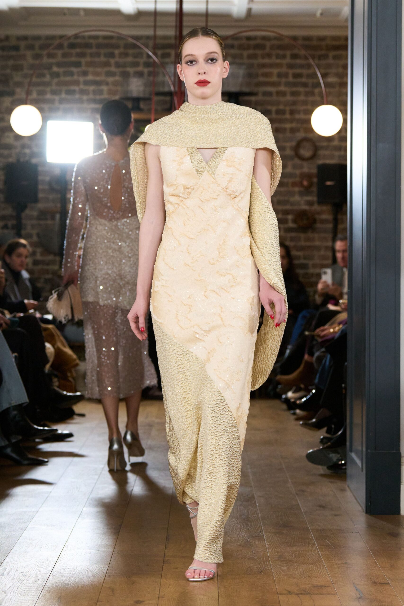 beige silk sleeveless v-neck fitted draped flowing gown