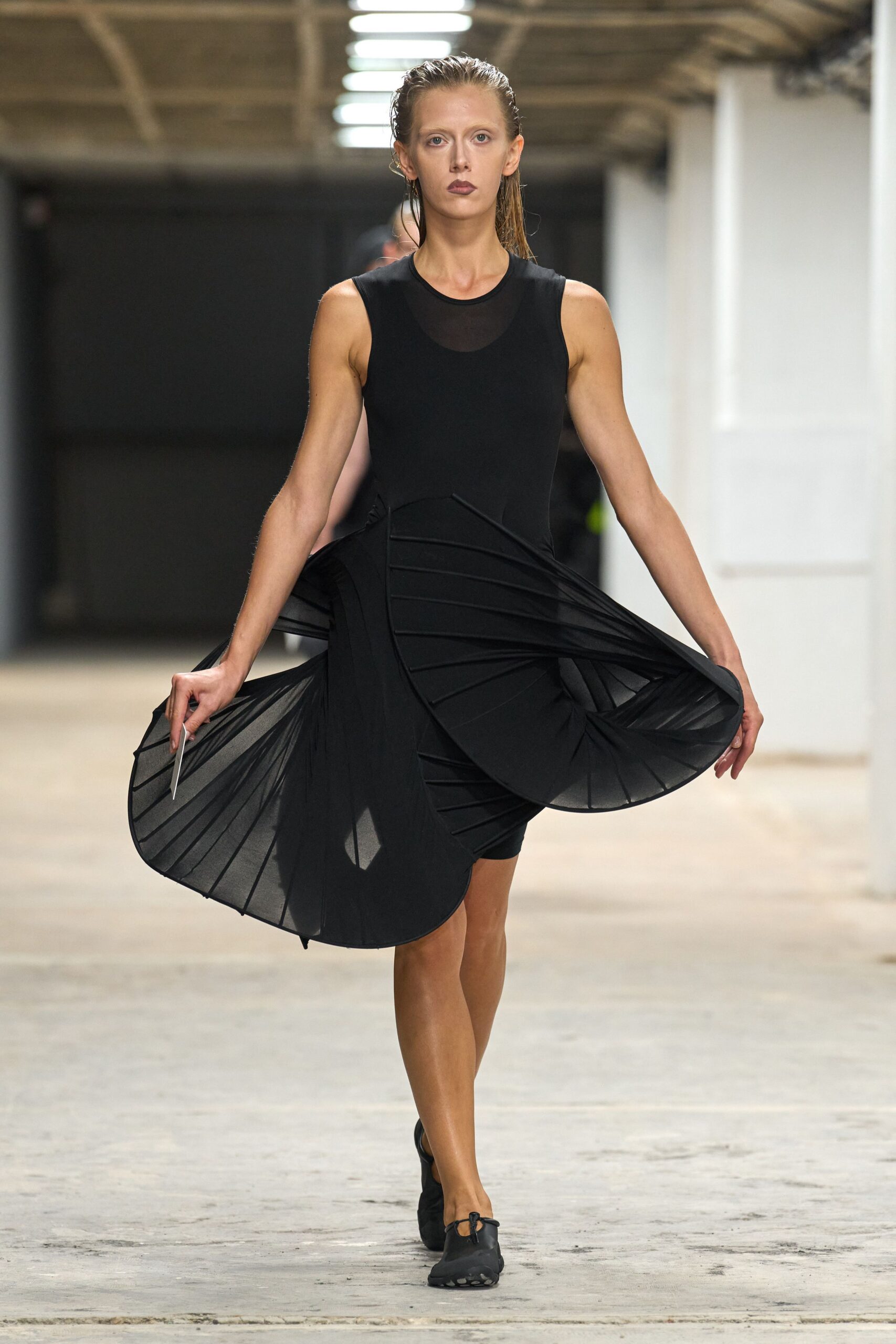 black pleated sleeveless dress