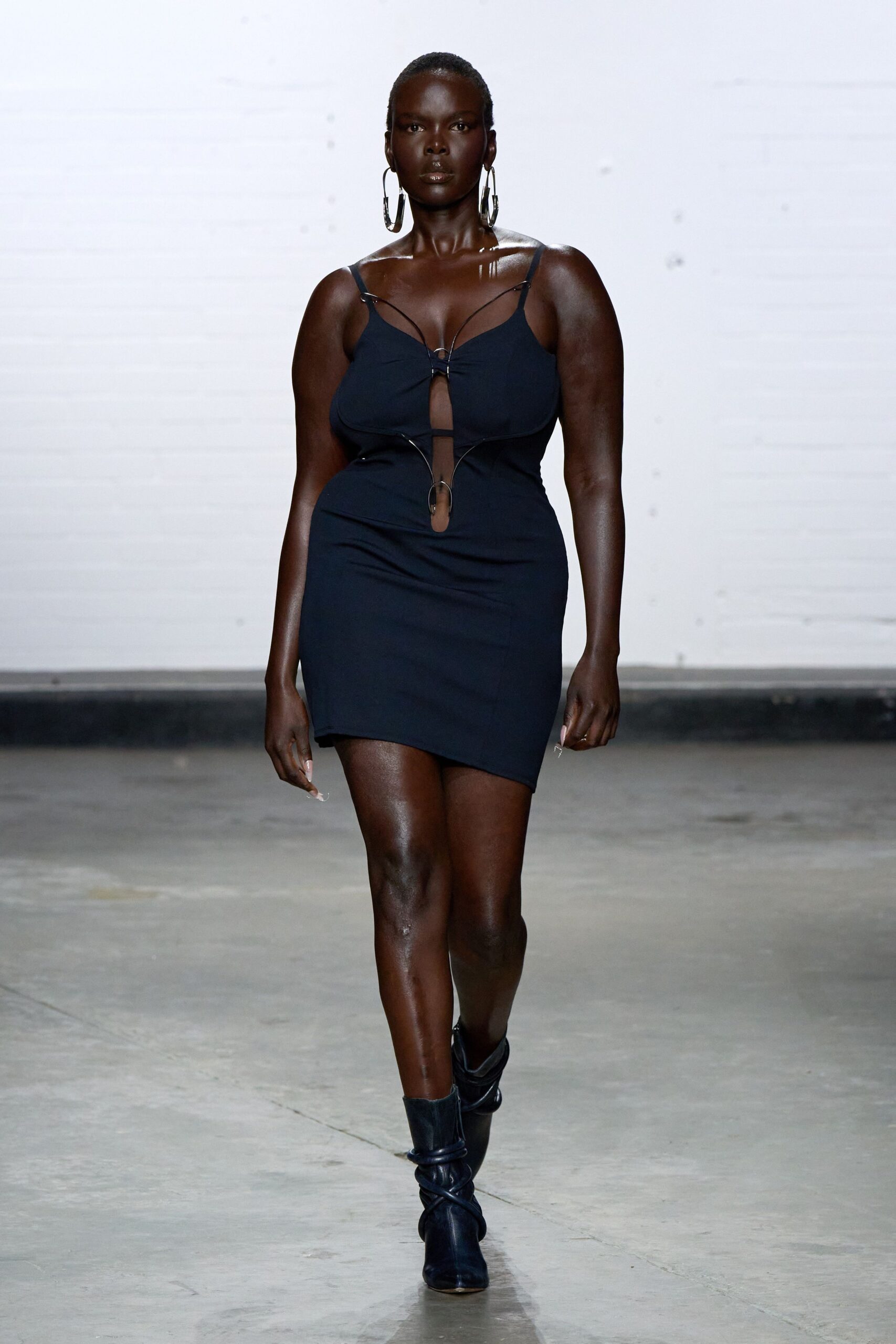 black fitted mini dress with boots