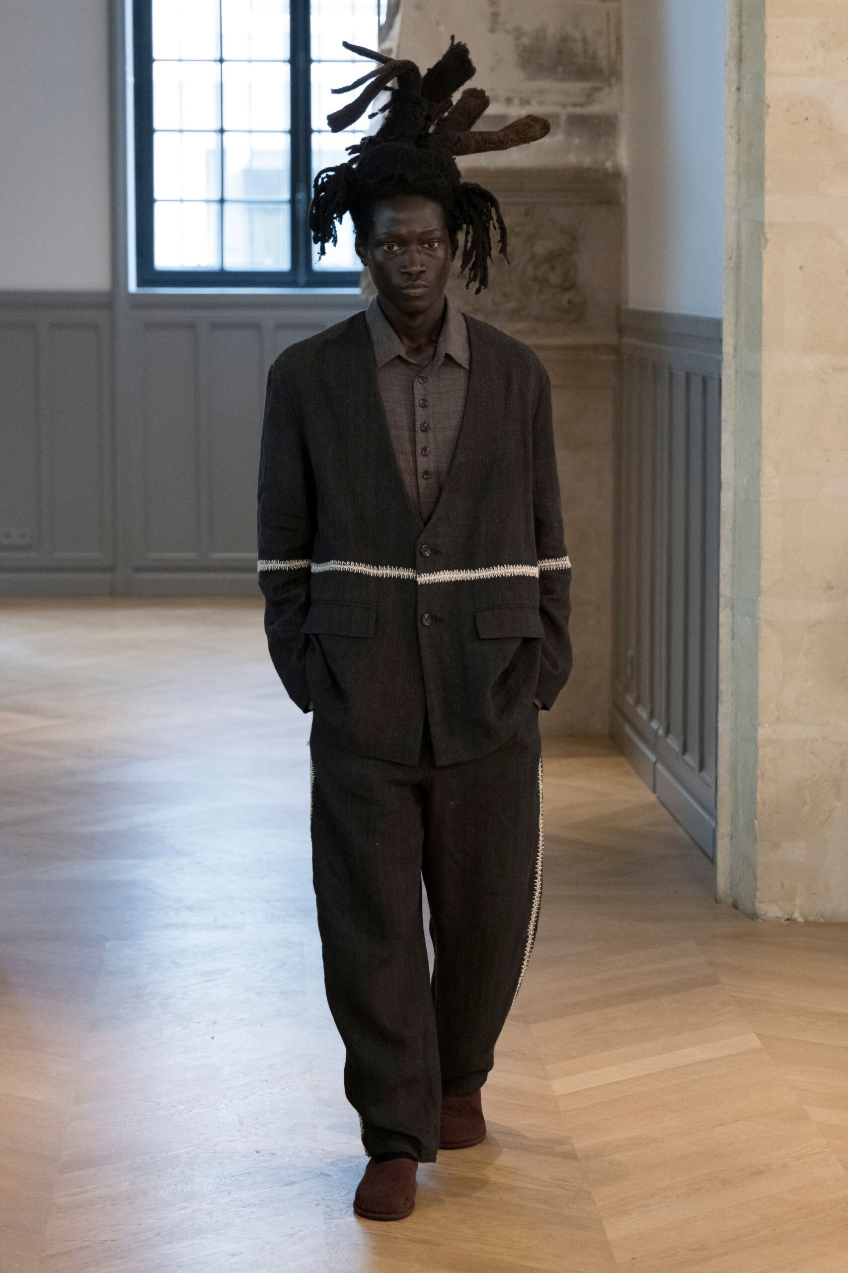 black relaxed suit with brown shoes