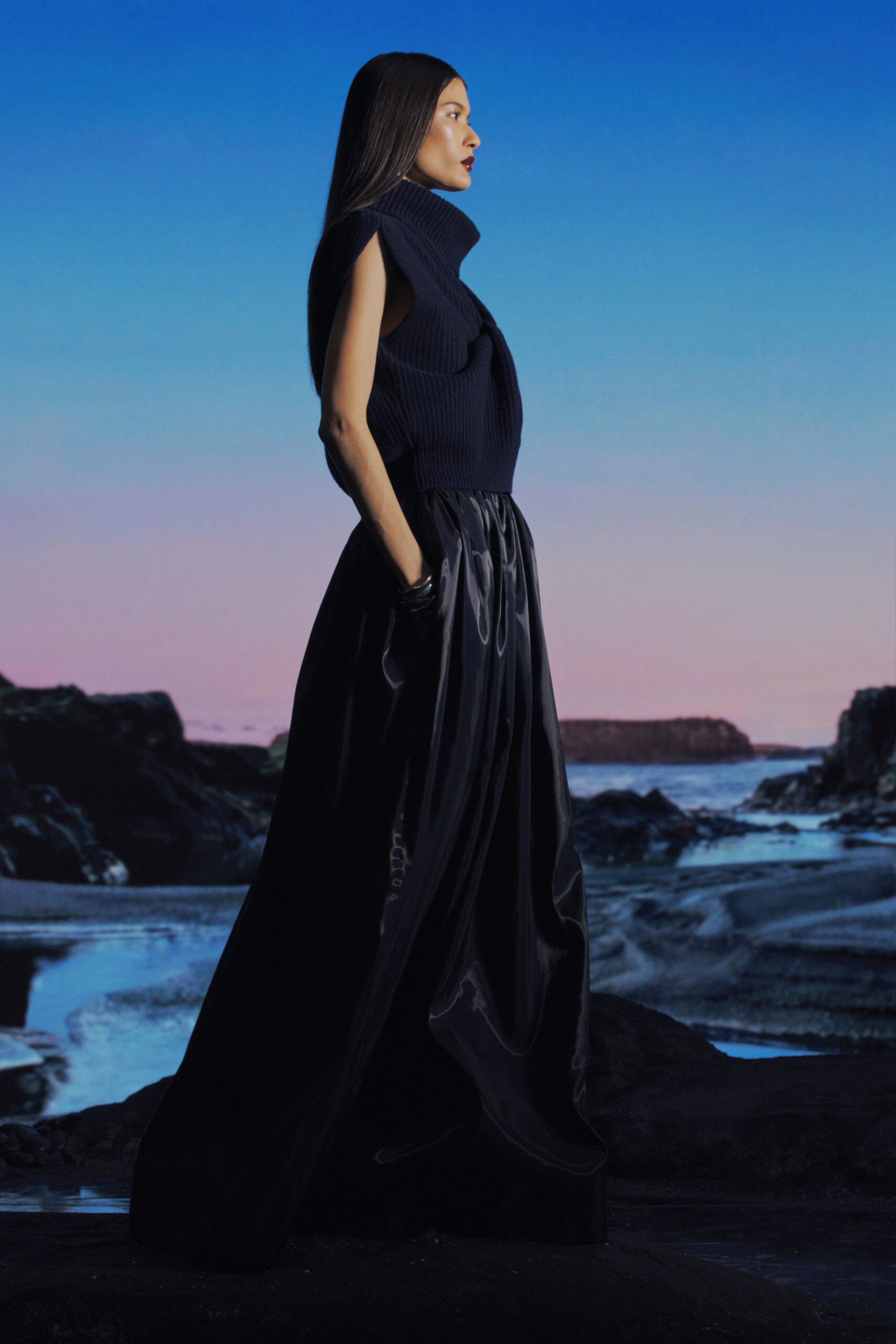 black knit sleeveless high-neck fitted draped top