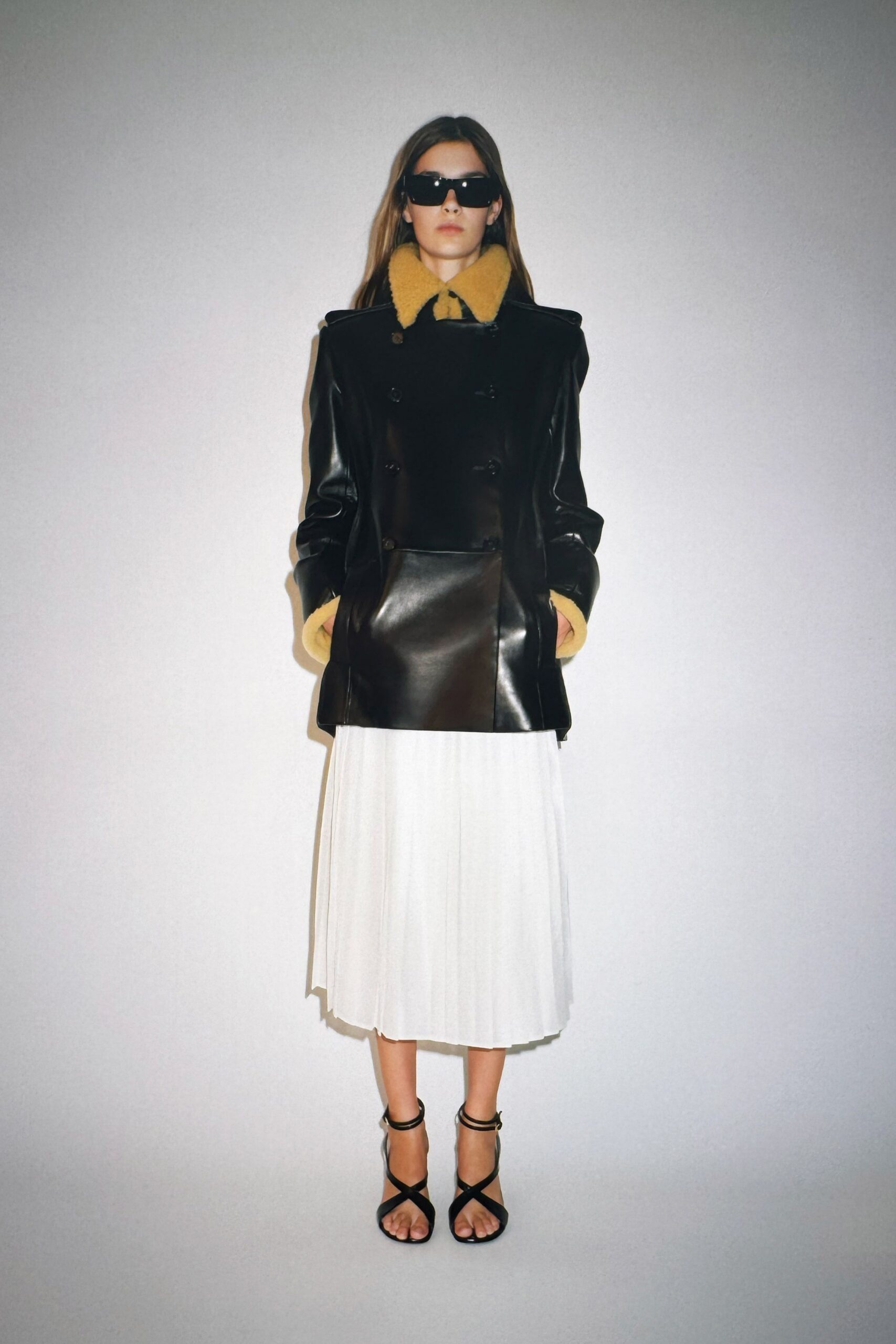 black leather coat with white skirt