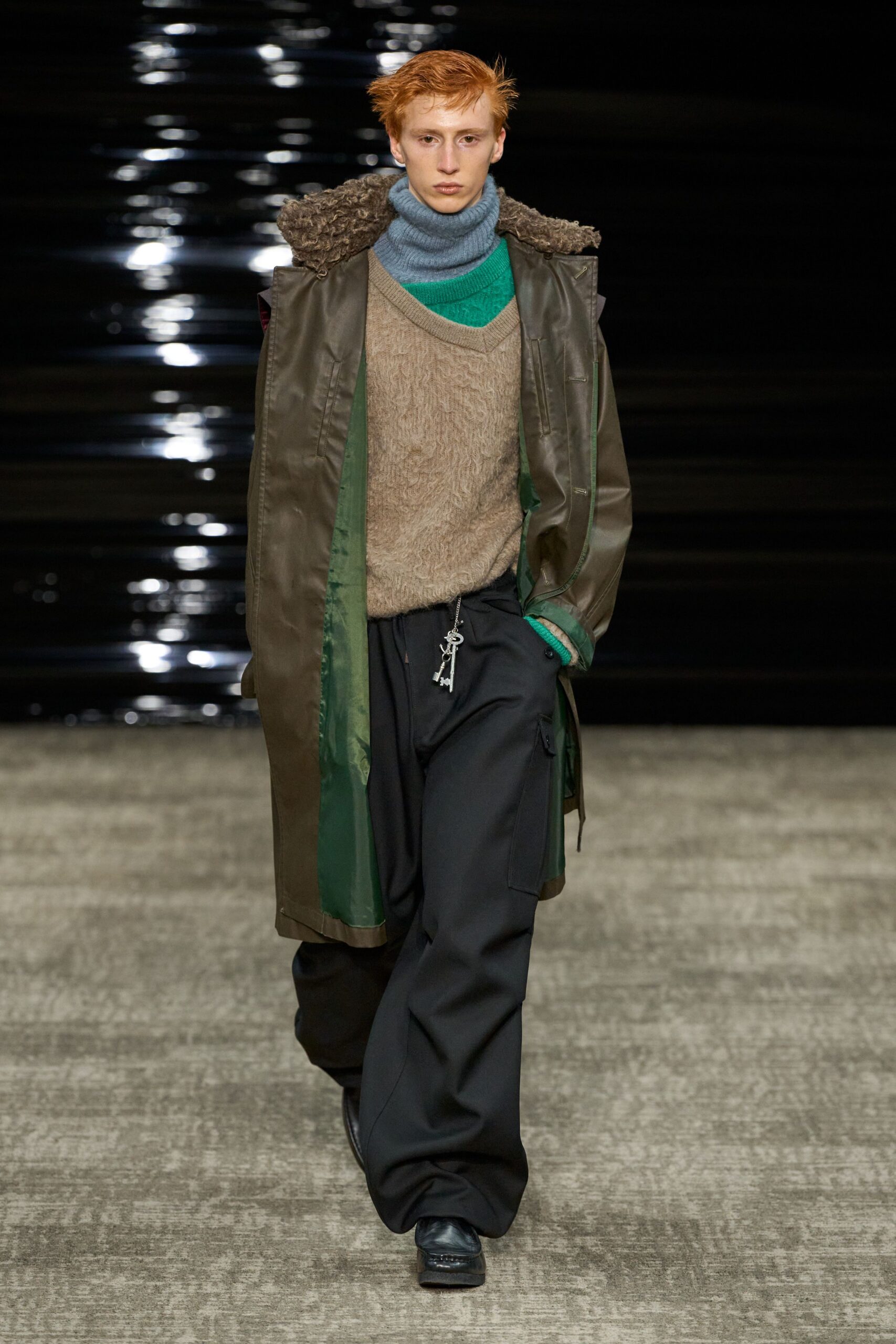 green vinyl coat with beige sweater