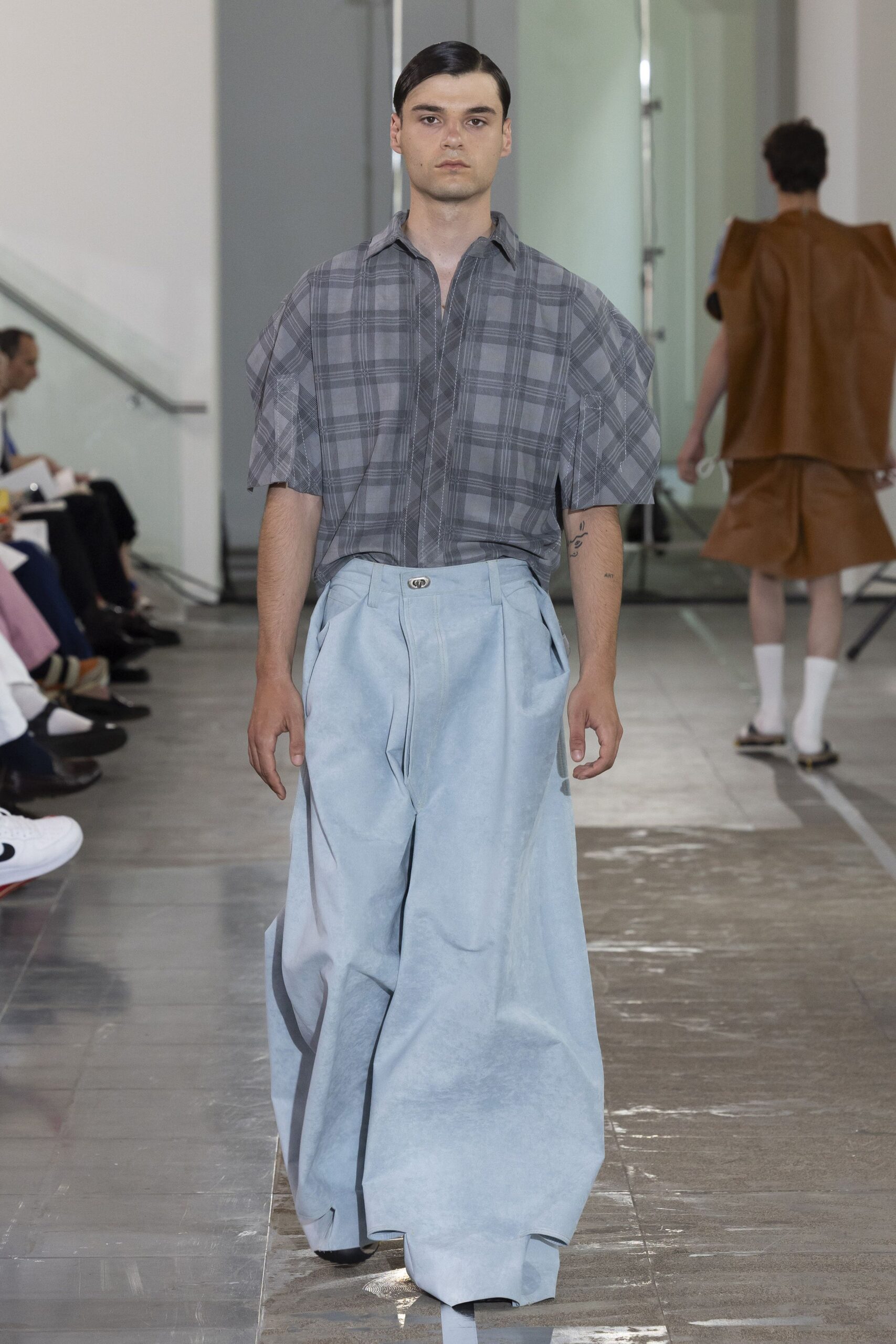 gray checked shirt with blue wide-leg pants