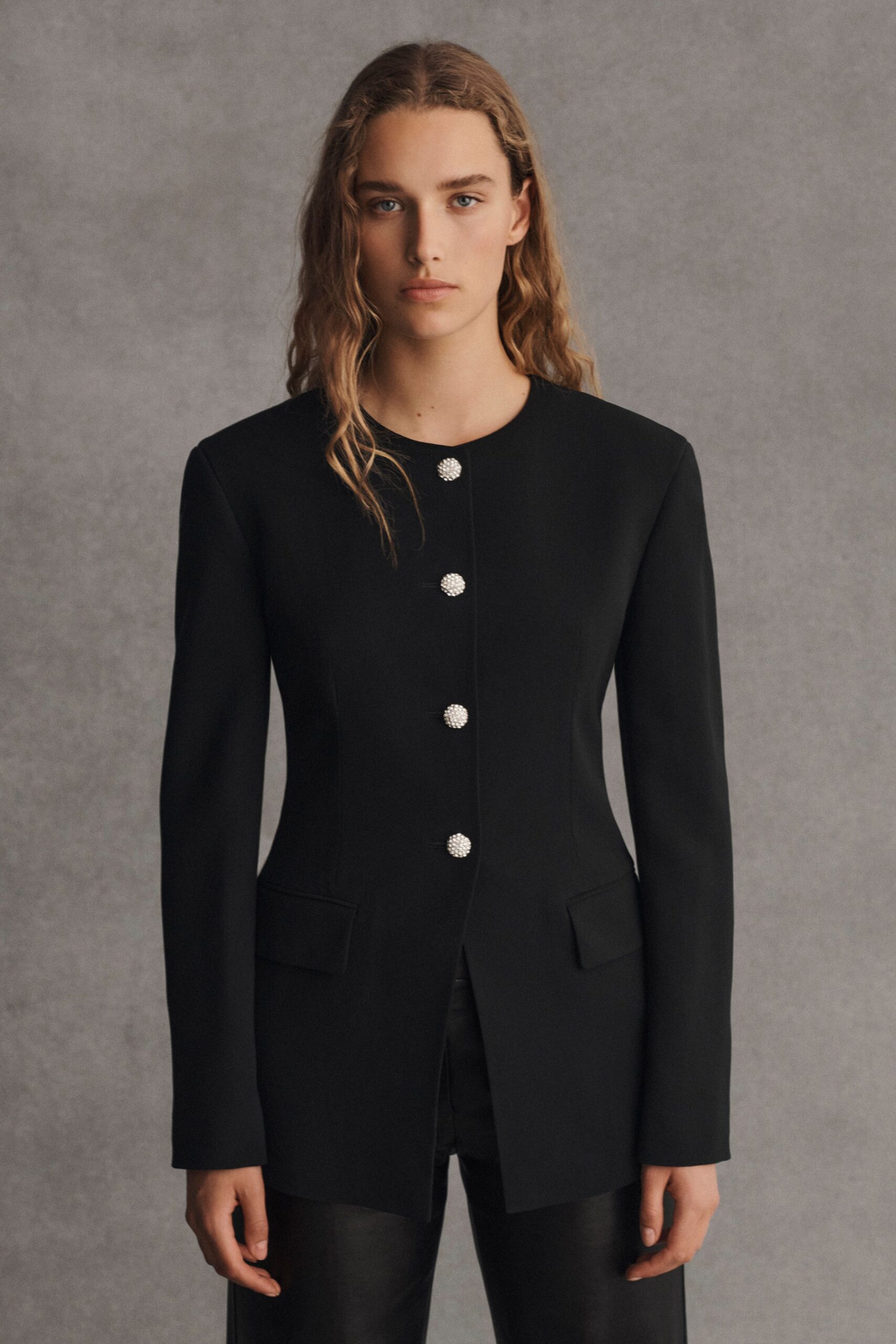 black structured blazer and fitted pants