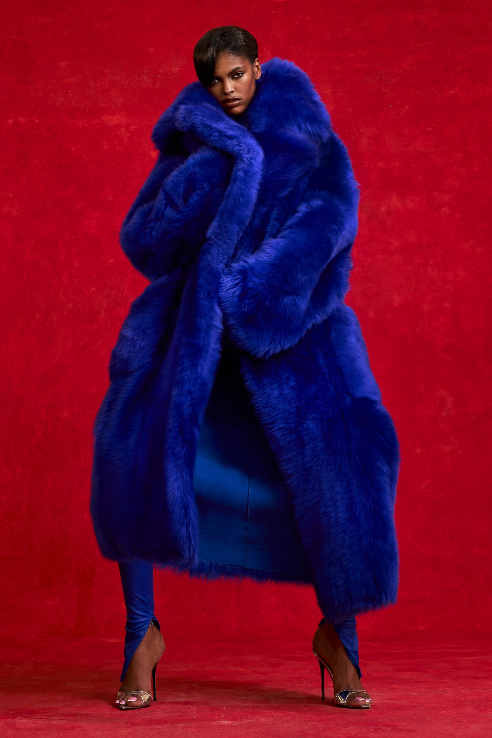 blue faux-fur coat with dress