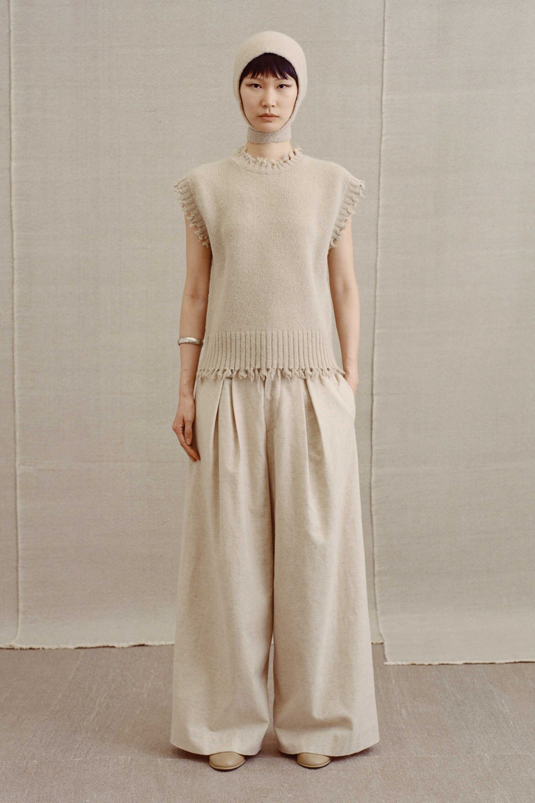 beige wool sleeveless high-neck relaxed fringed top