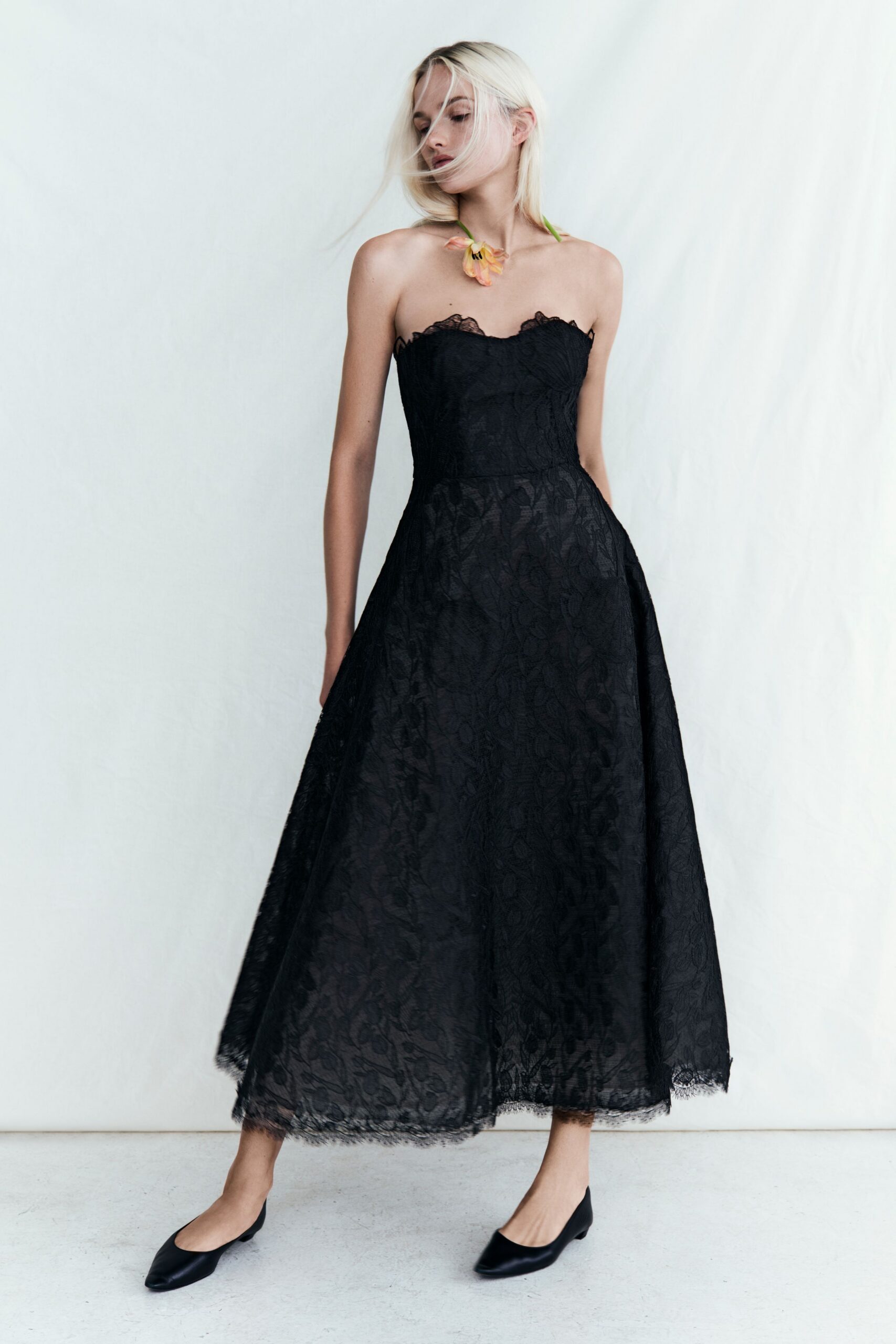 black lace strapless fitted flared midi gown