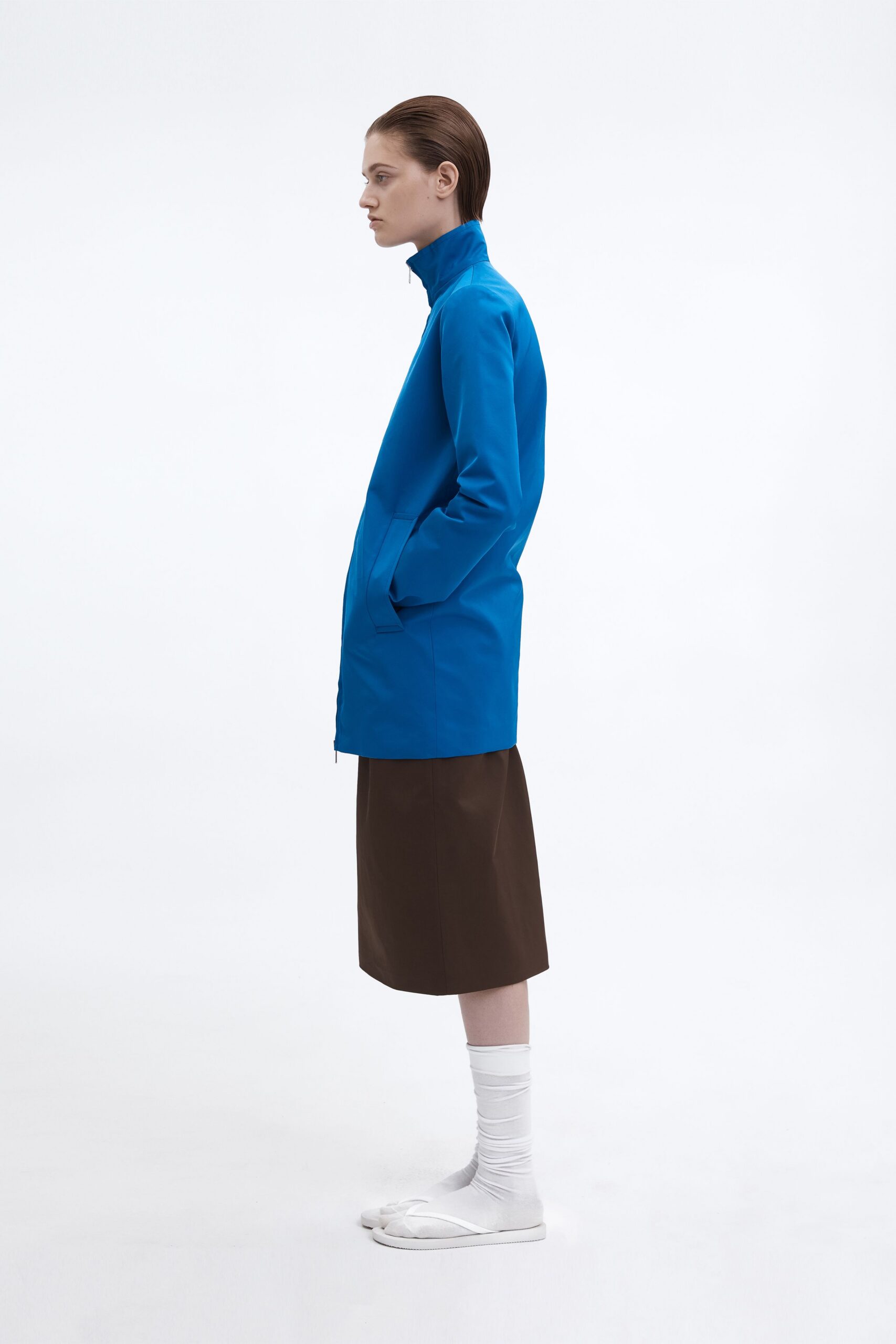 blue jacket brown skirt white shoes