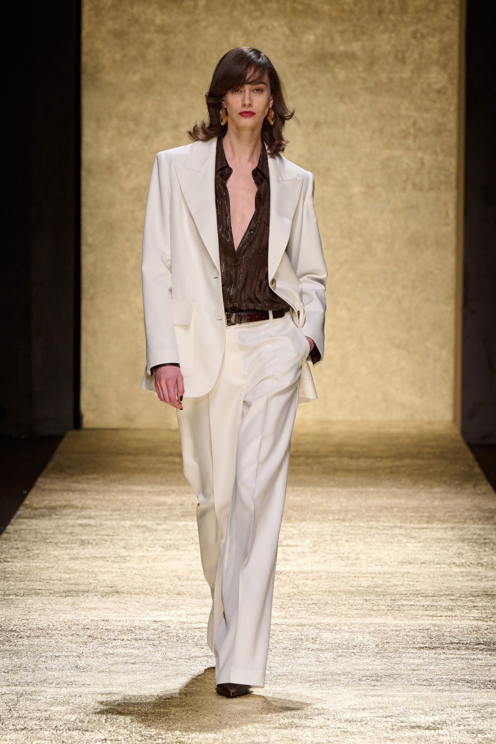 white tailored suit with brown shirt