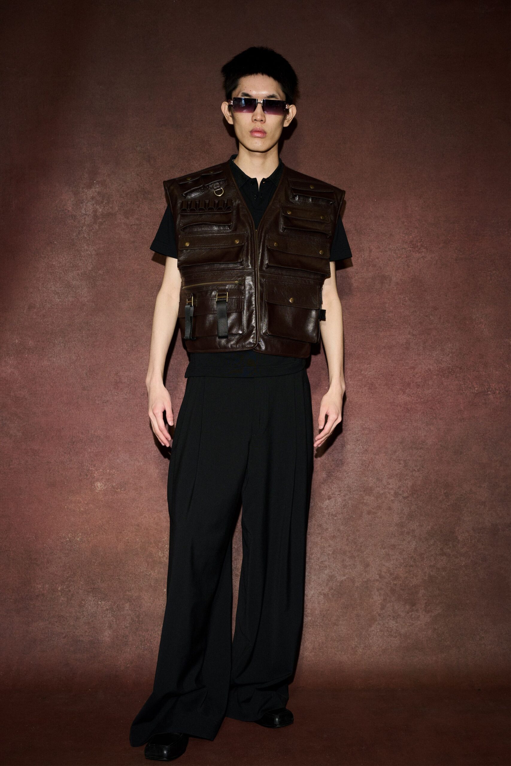 brown leather vest with black shirt