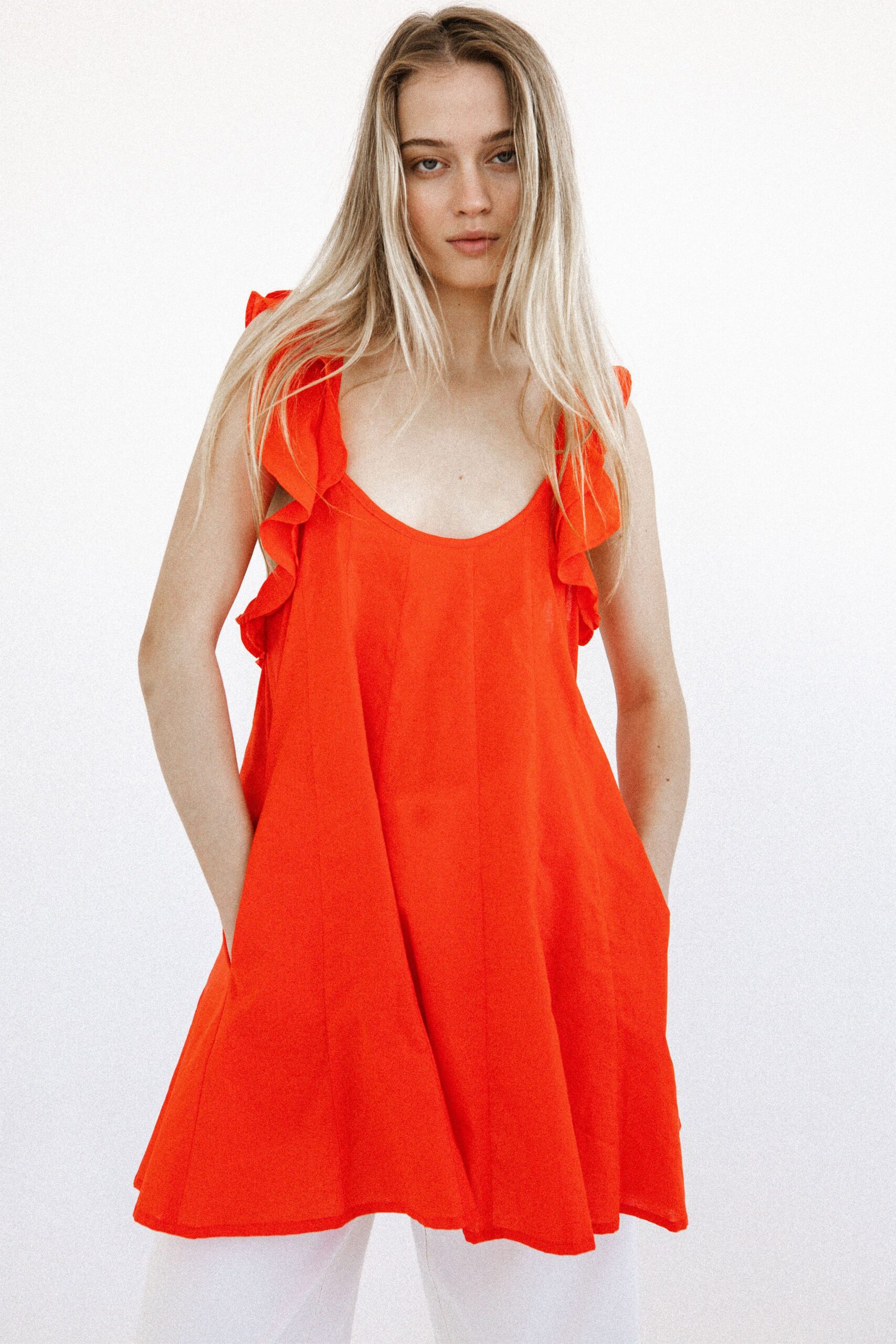 red ruffled sleeveless top