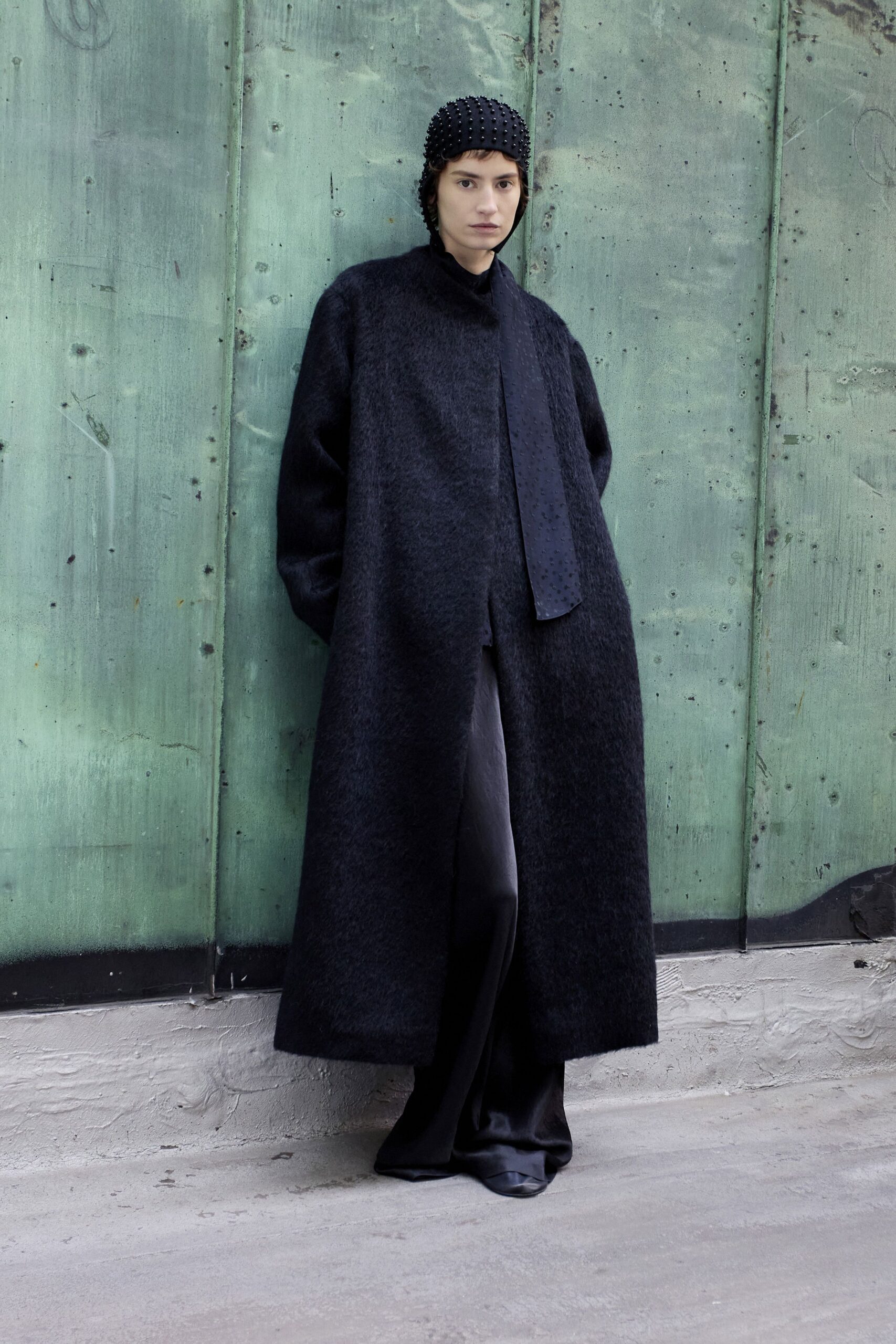 black wool coat with silk pants