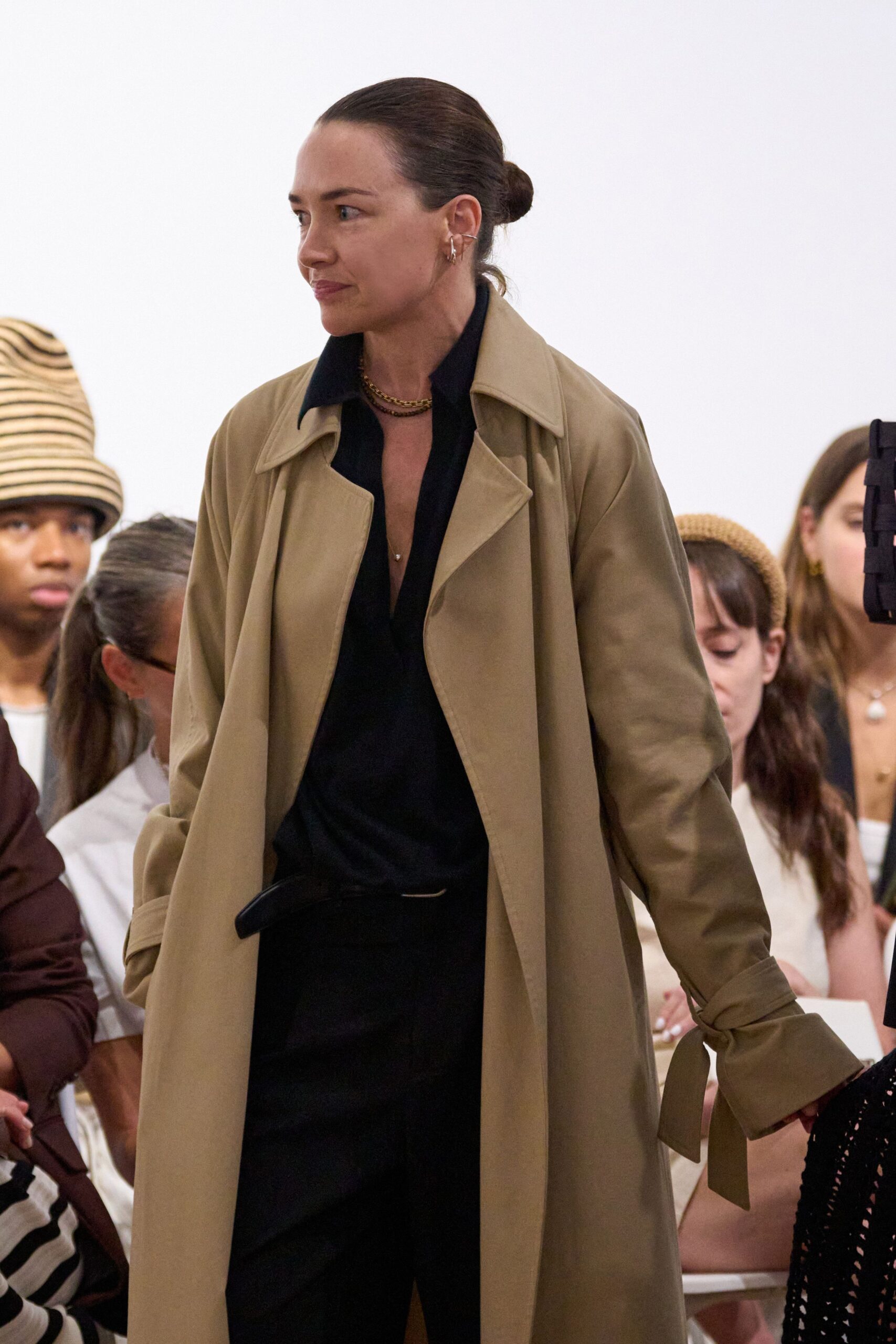 beige trench coat with black shirt and pants