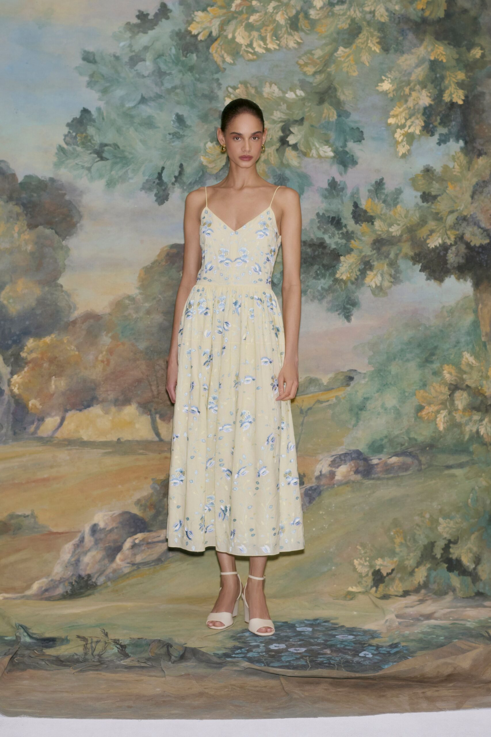 yellow floral midi dress with white shoes
