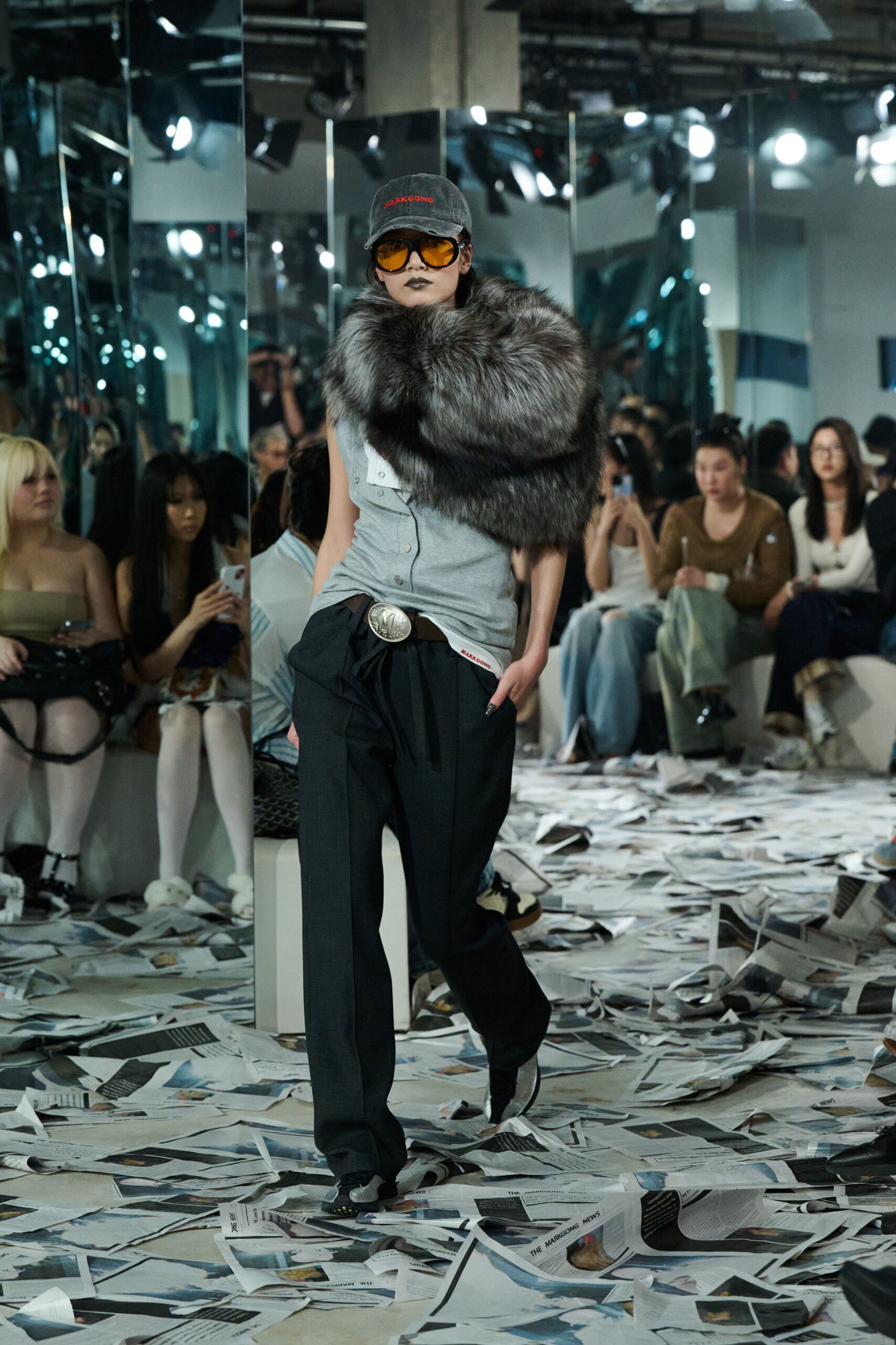 gray sleeveless top with black pants