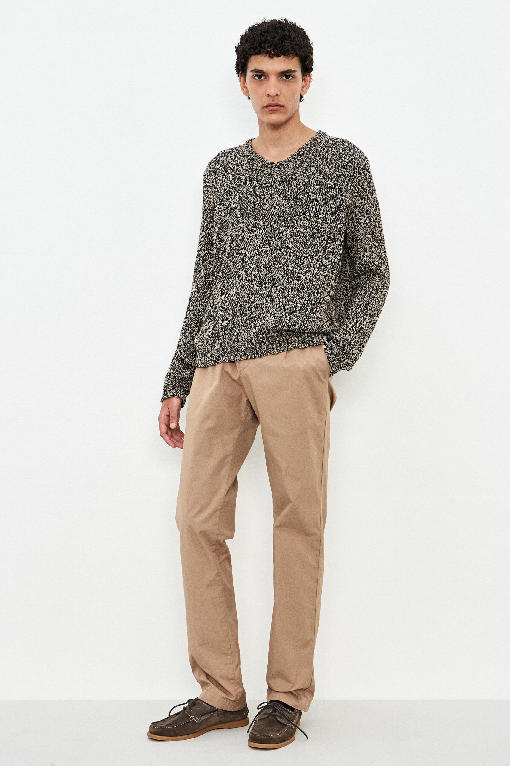 black cotton long-sleeve v-neck relaxed textured sweater