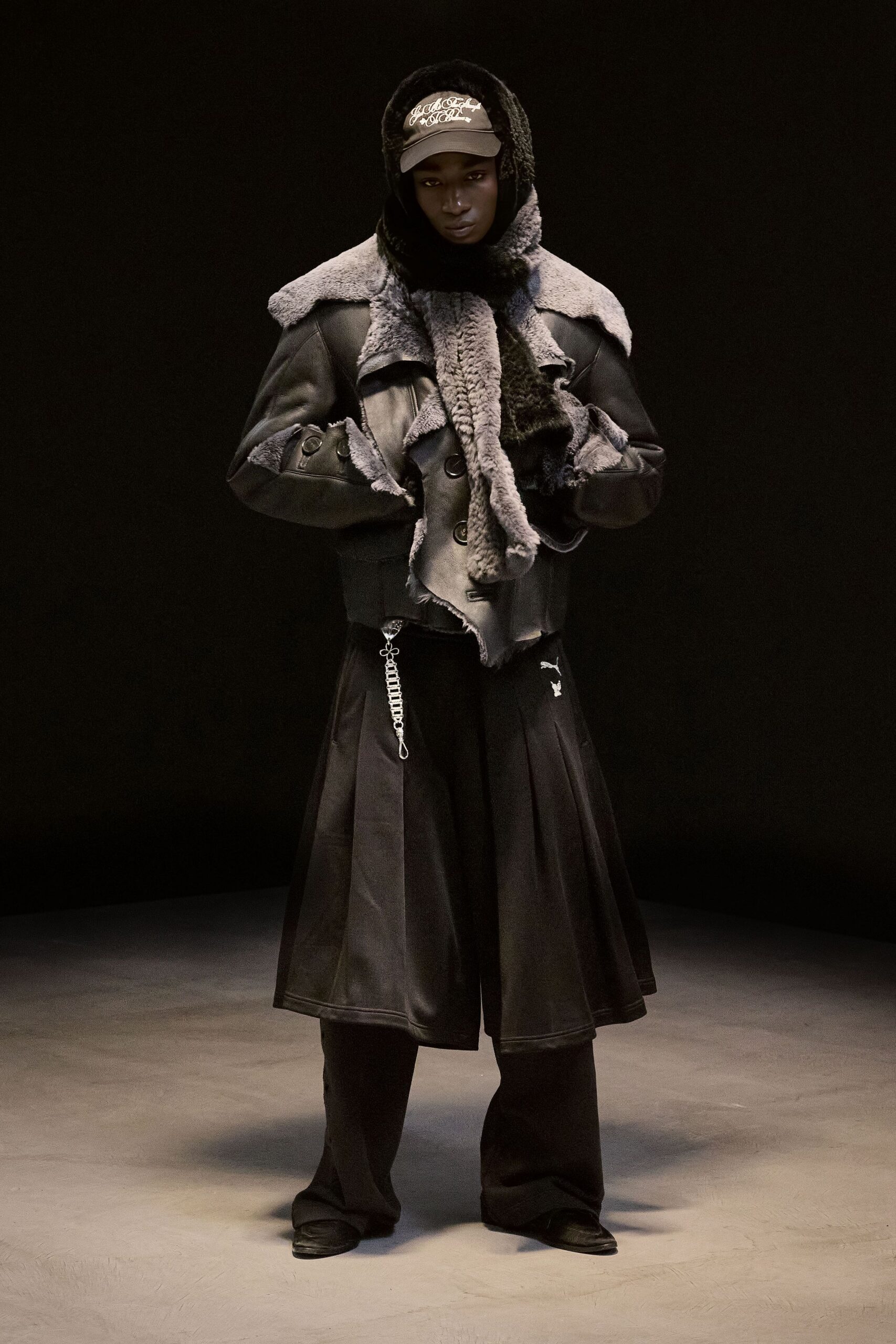 black wool long-sleeve collared structured layered coat