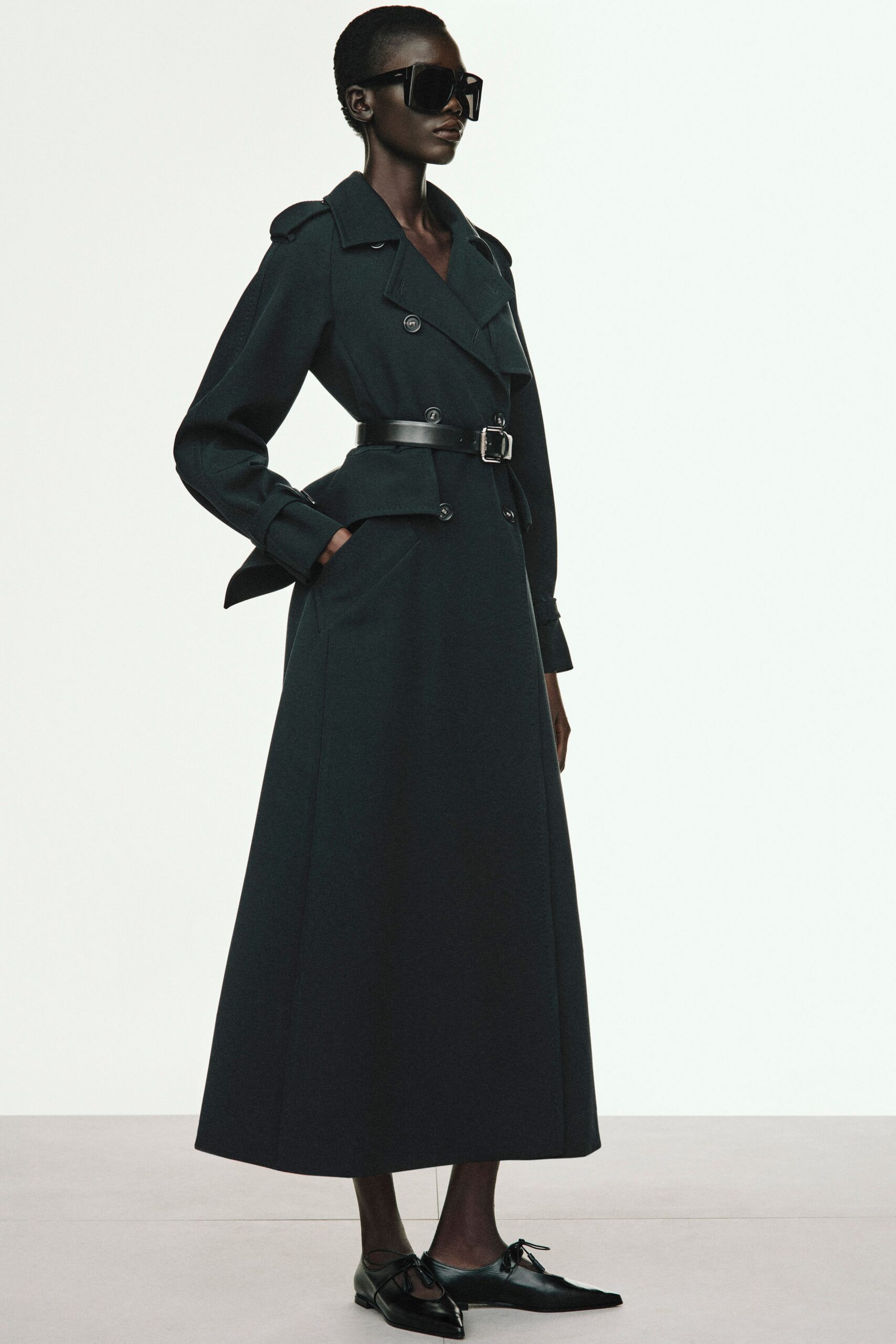 black wool long-sleeve collared fitted belted pockets trench