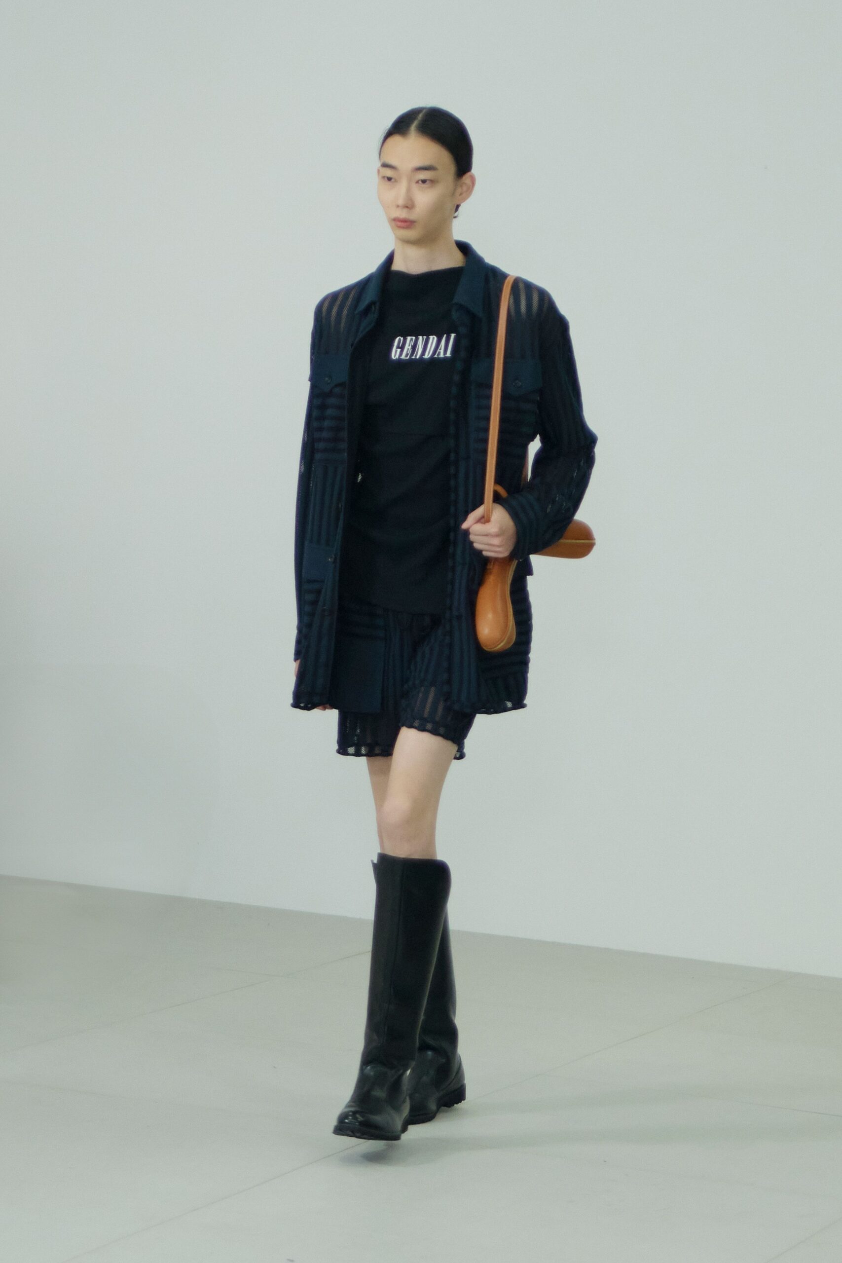 black shirt blue pleated skirt