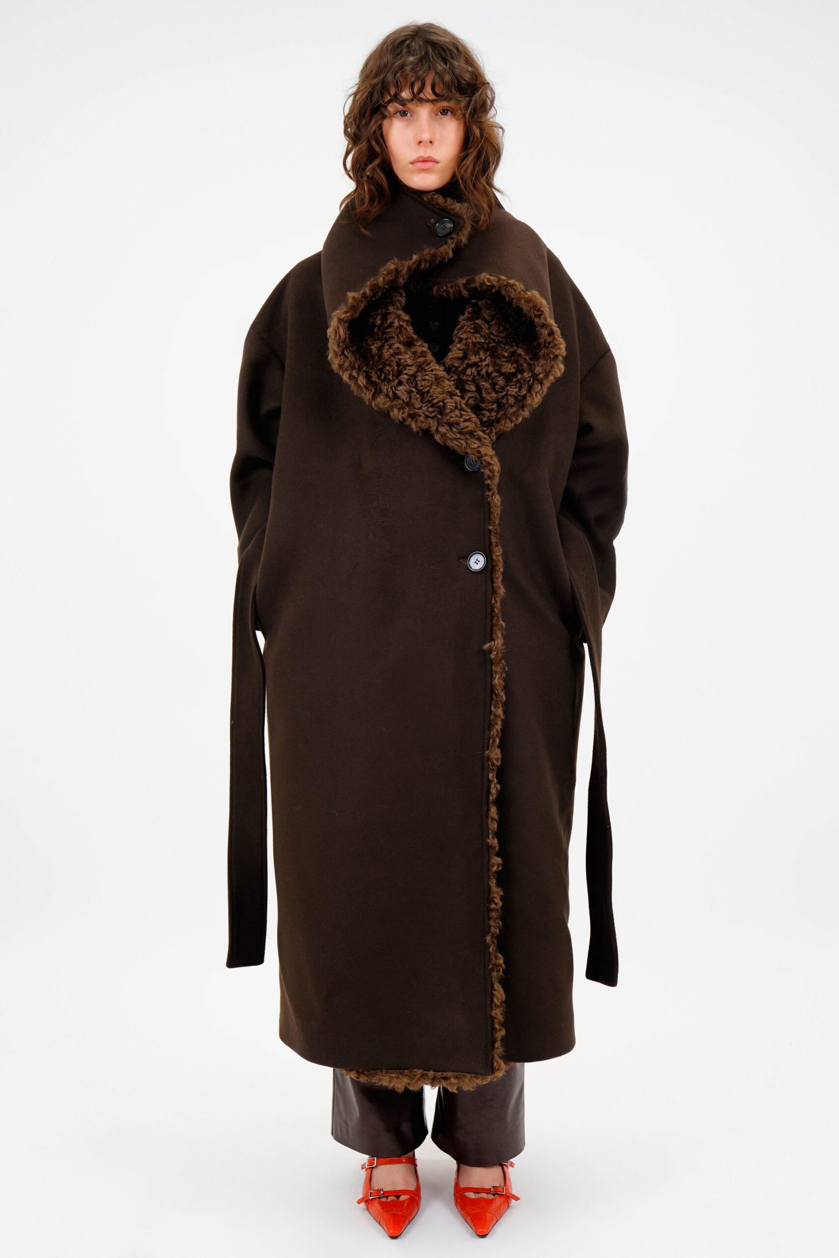 brown wool relaxed coat with gray pants and red heels