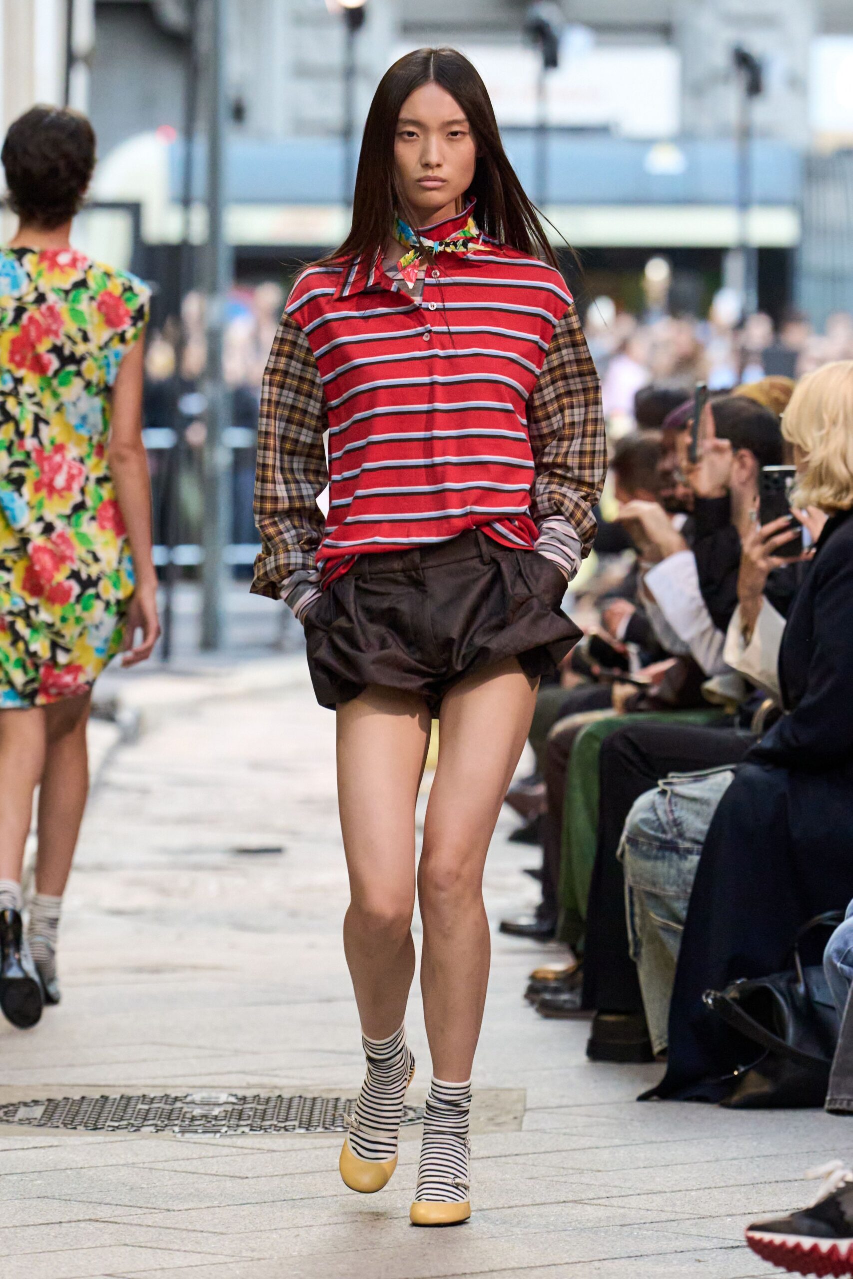 striped shirt and black shorts