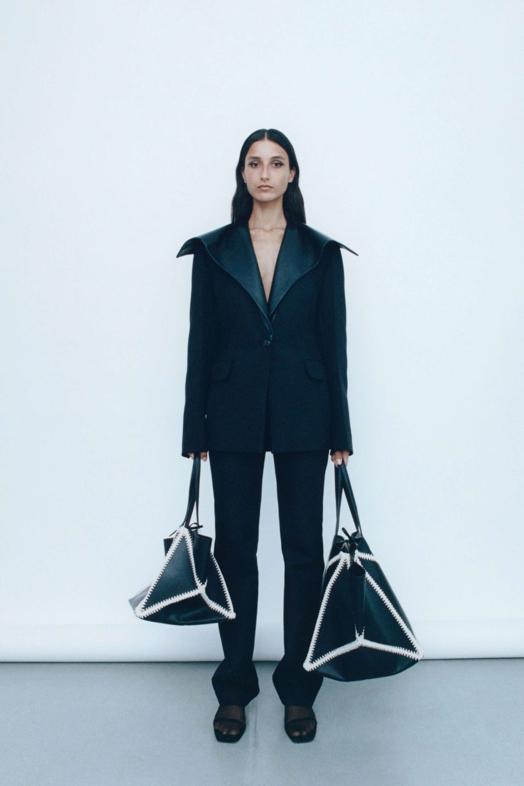 black wool long-sleeve collared tailored buttoned suit