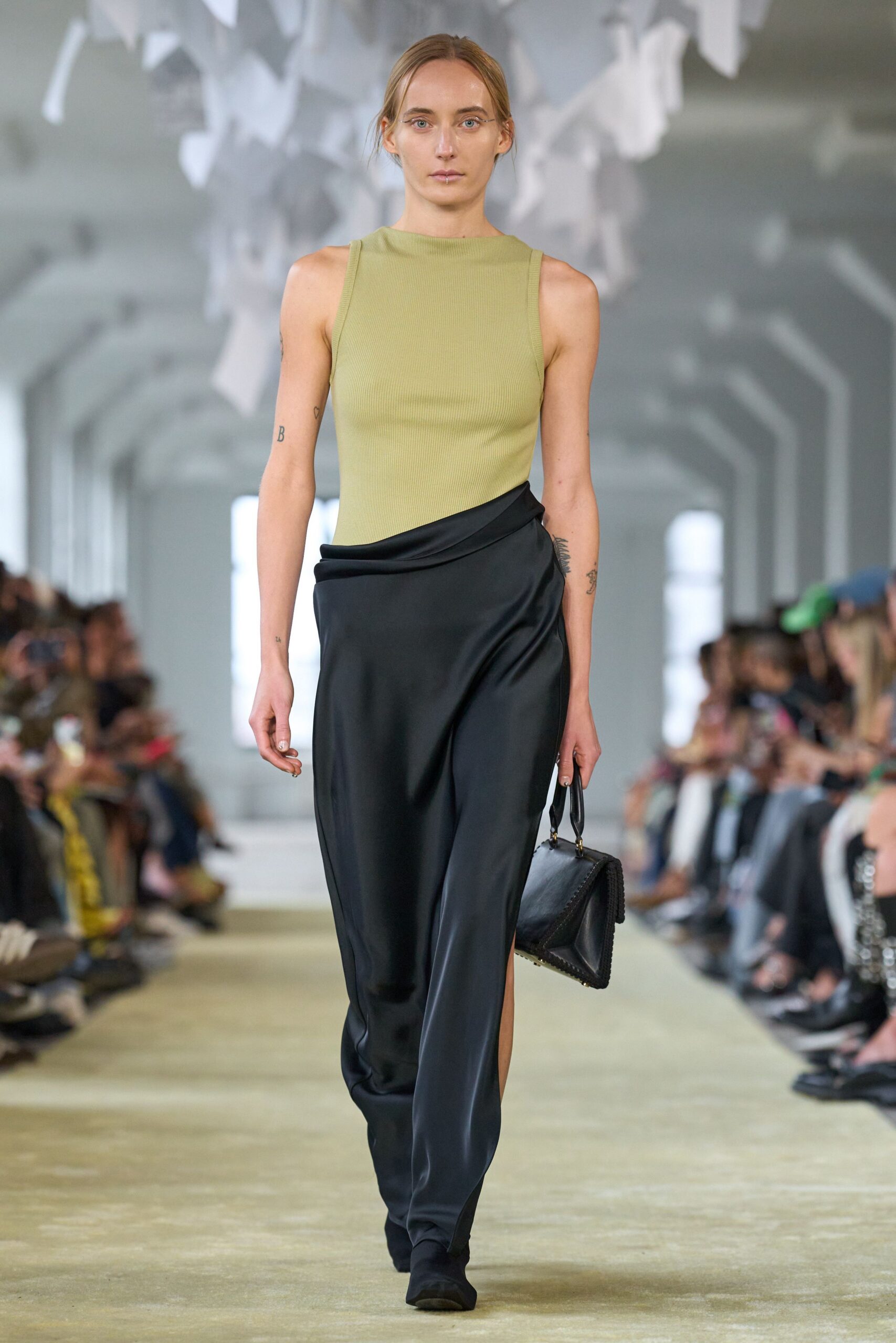 green fitted top black draped skirt