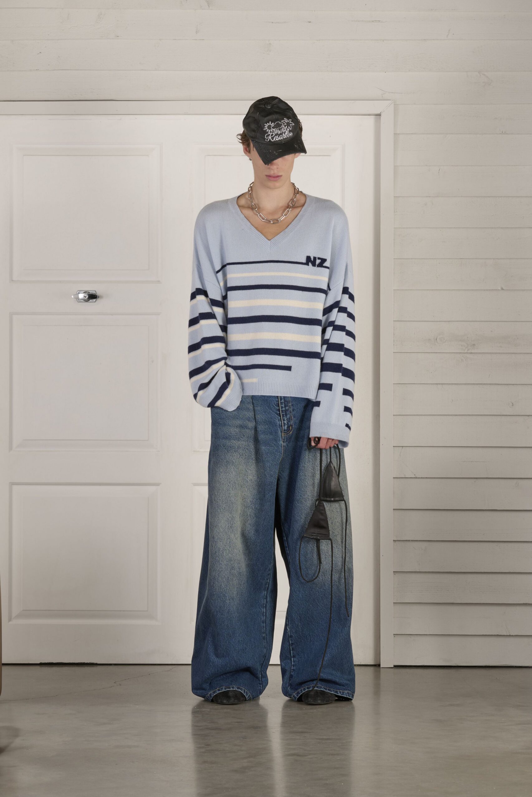 blue striped sweater with wide-leg jeans