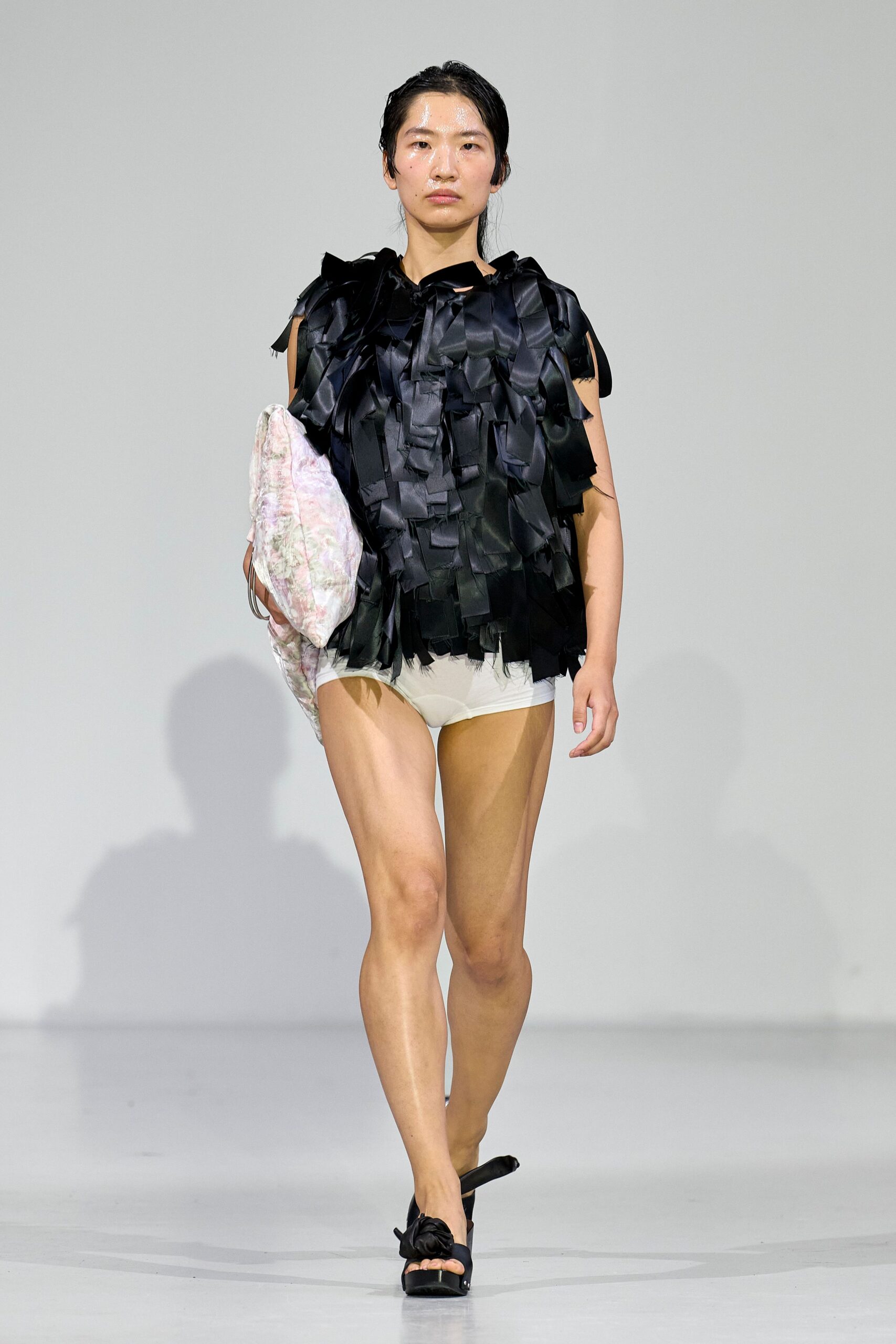 black fringed top with white shorts