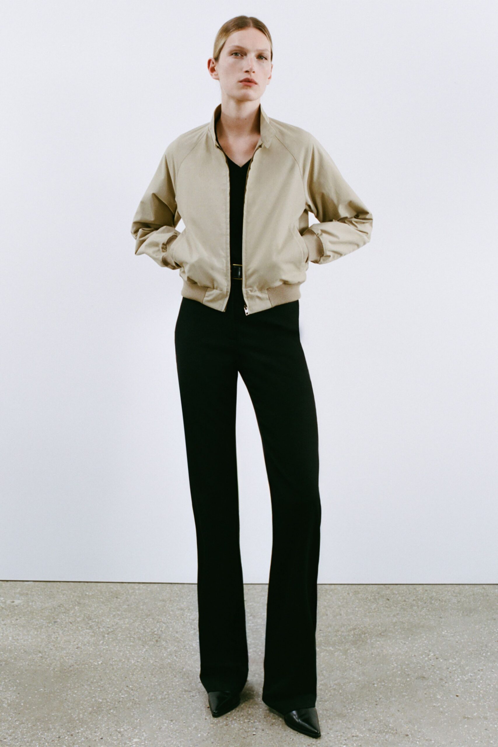 beige fitted jacket black pants