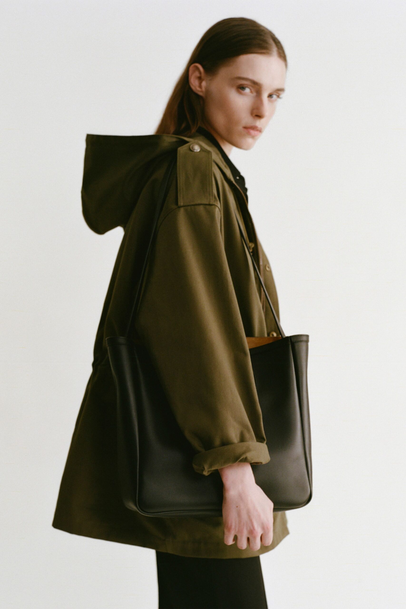 green relaxed jacket with black pants