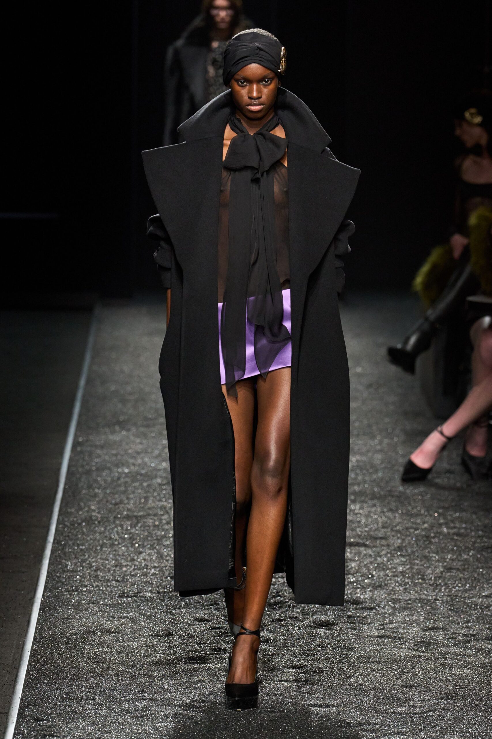 black coat with purple shorts
