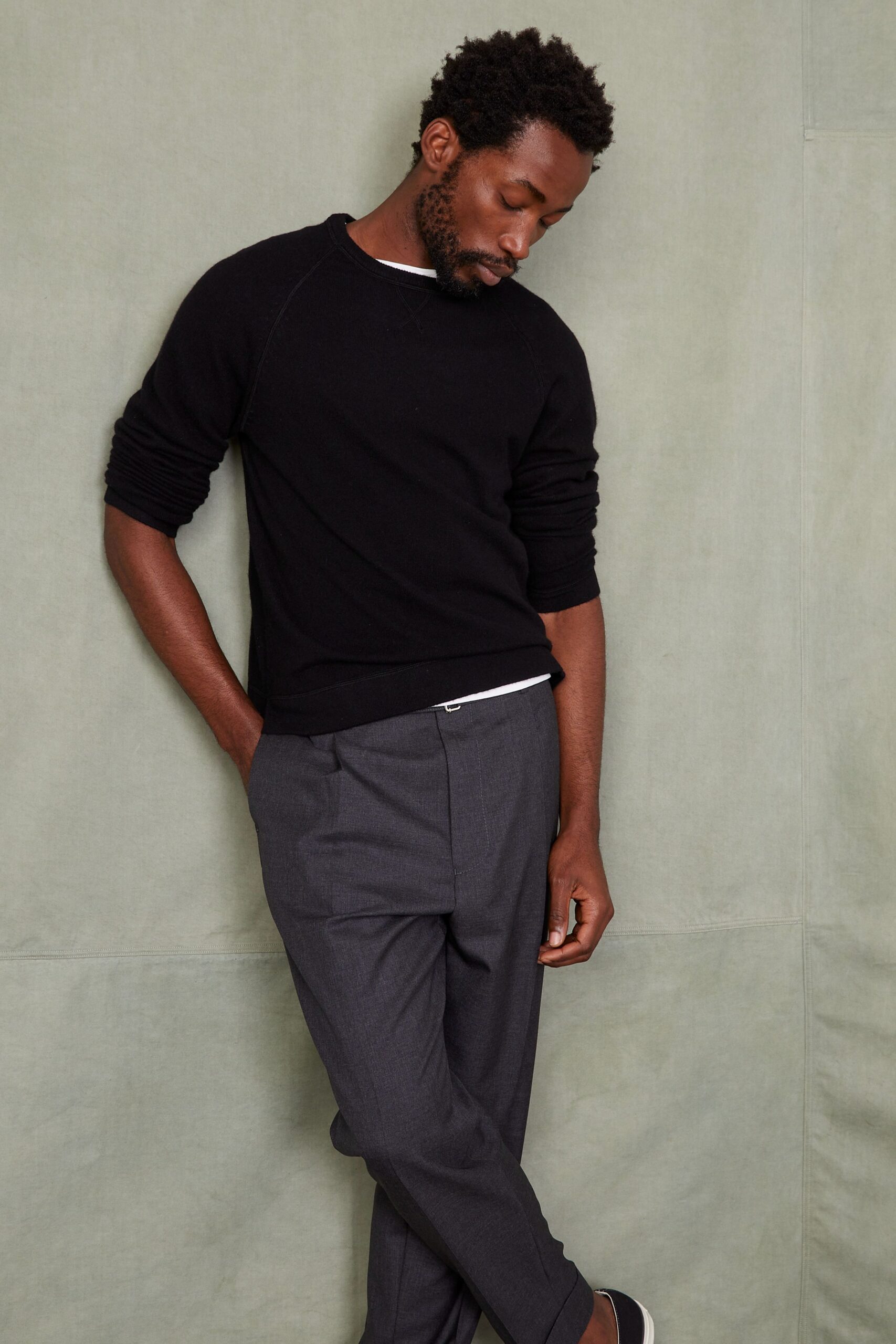 black relaxed sweater gray tailored pants