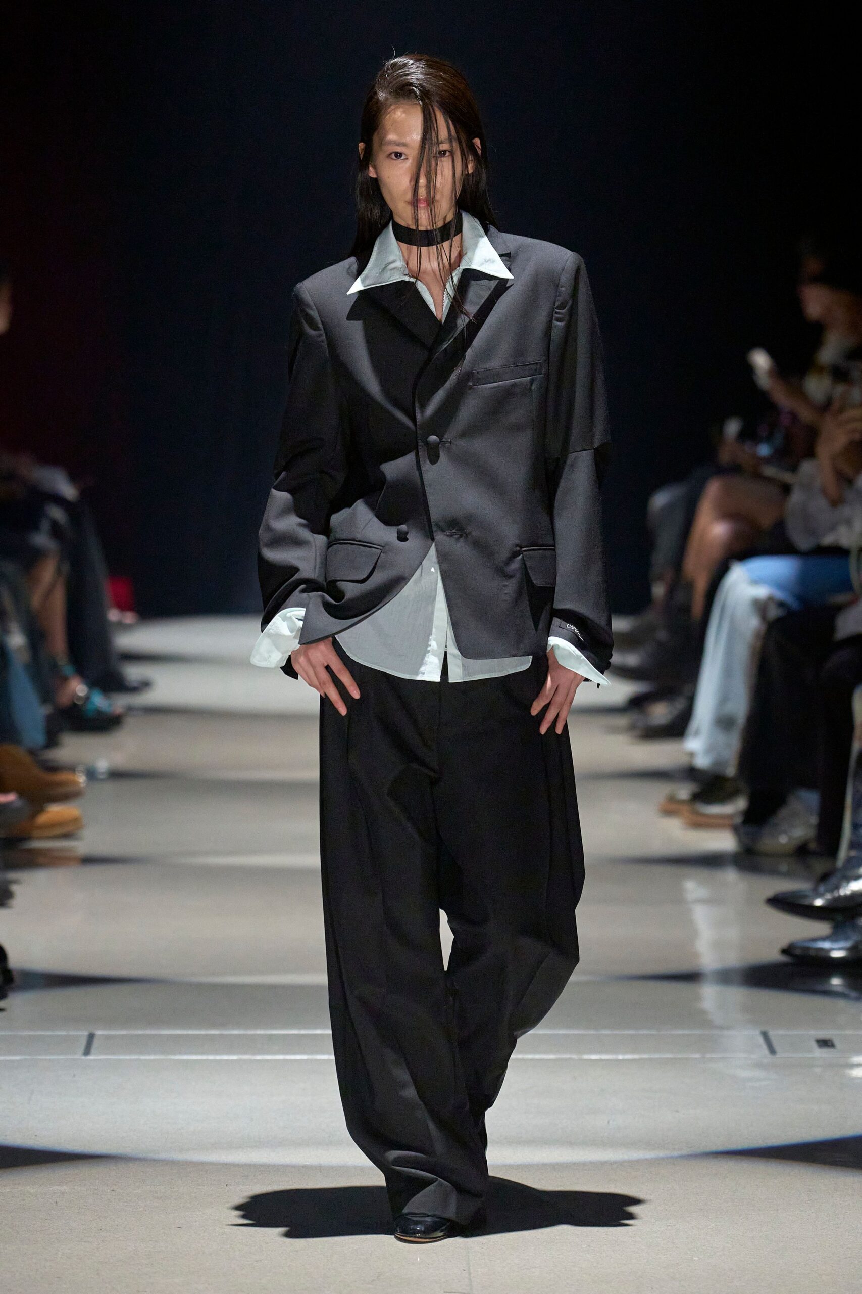 black relaxed suit with light blue shirt