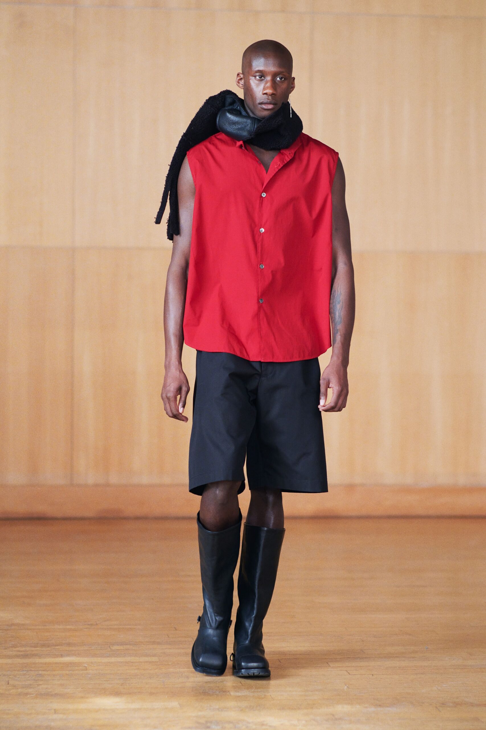 red sleeveless shirt with black shorts