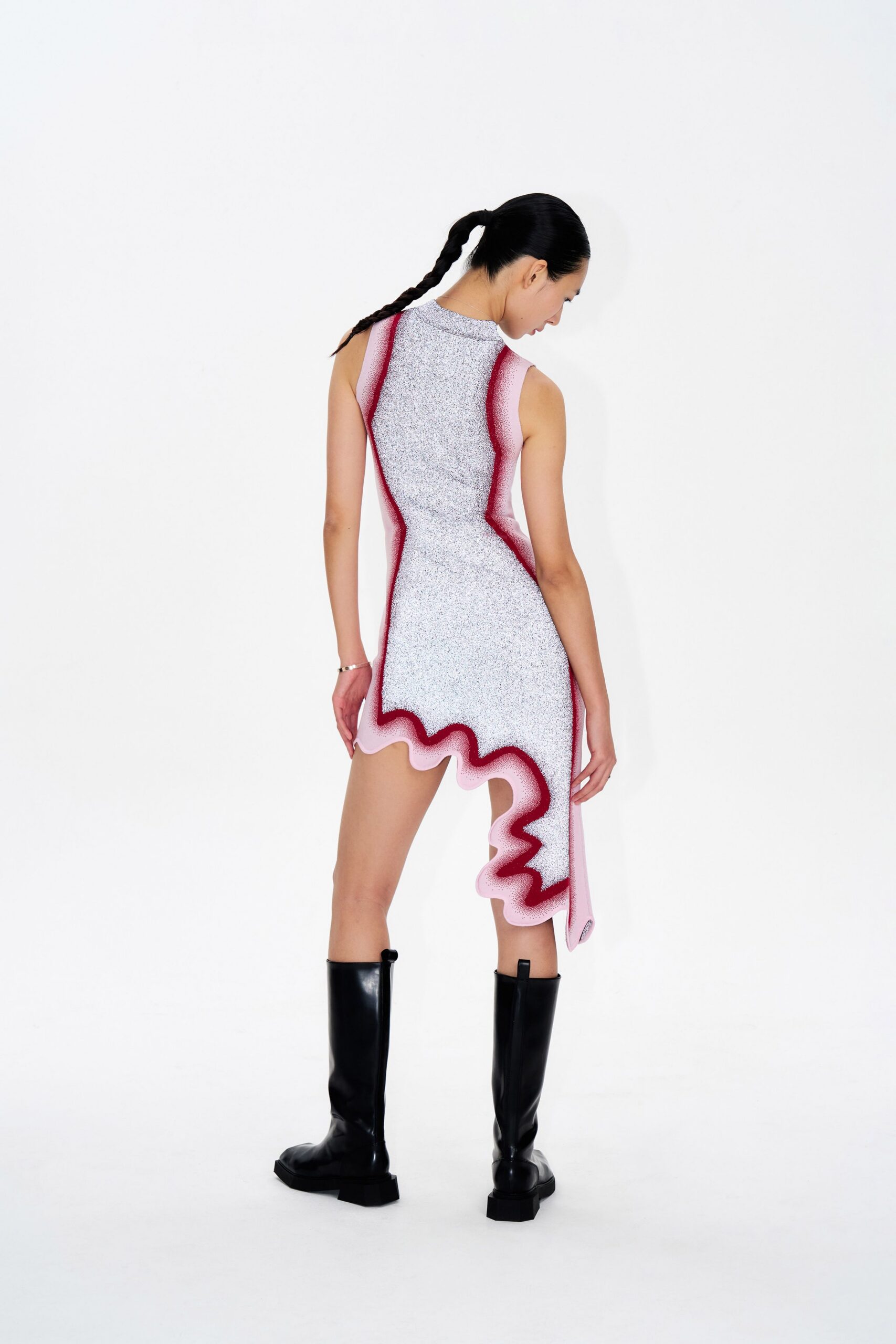 asymmetric pink and white dress with black boots