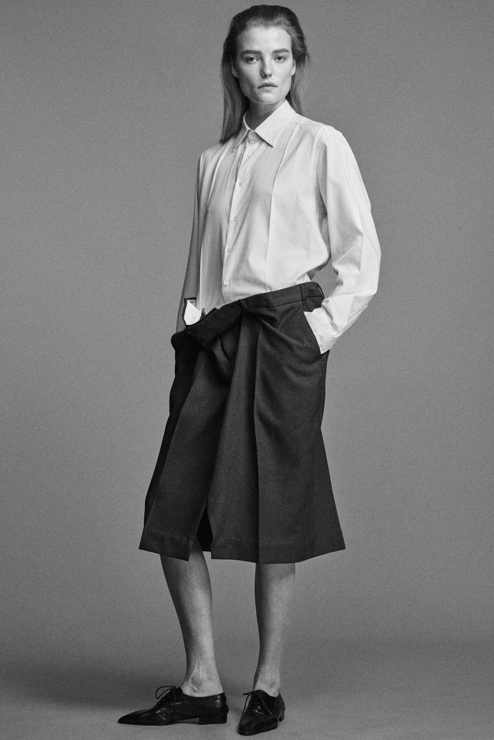 white relaxed shirt with black shorts