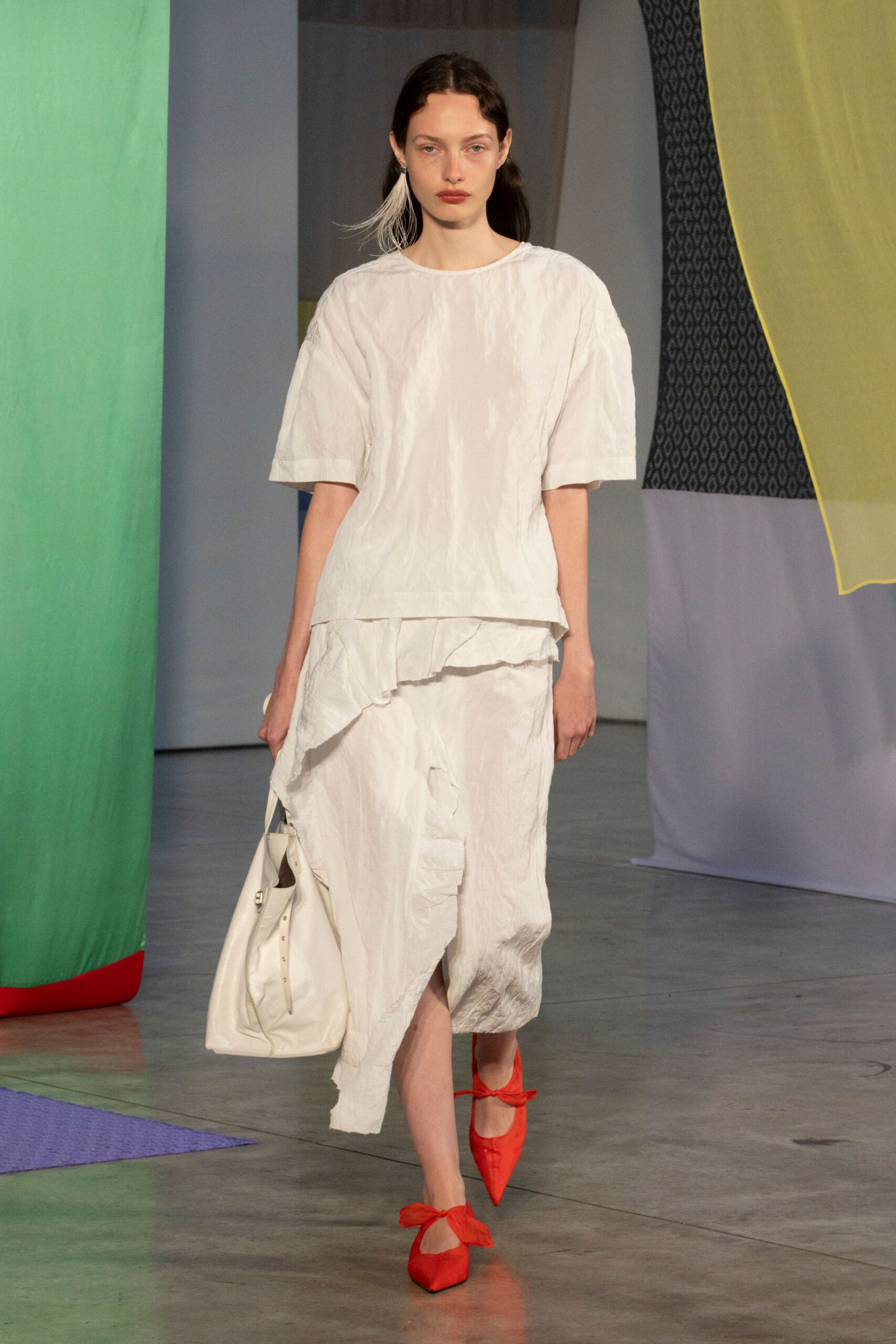 white relaxed top with asymmetric skirt