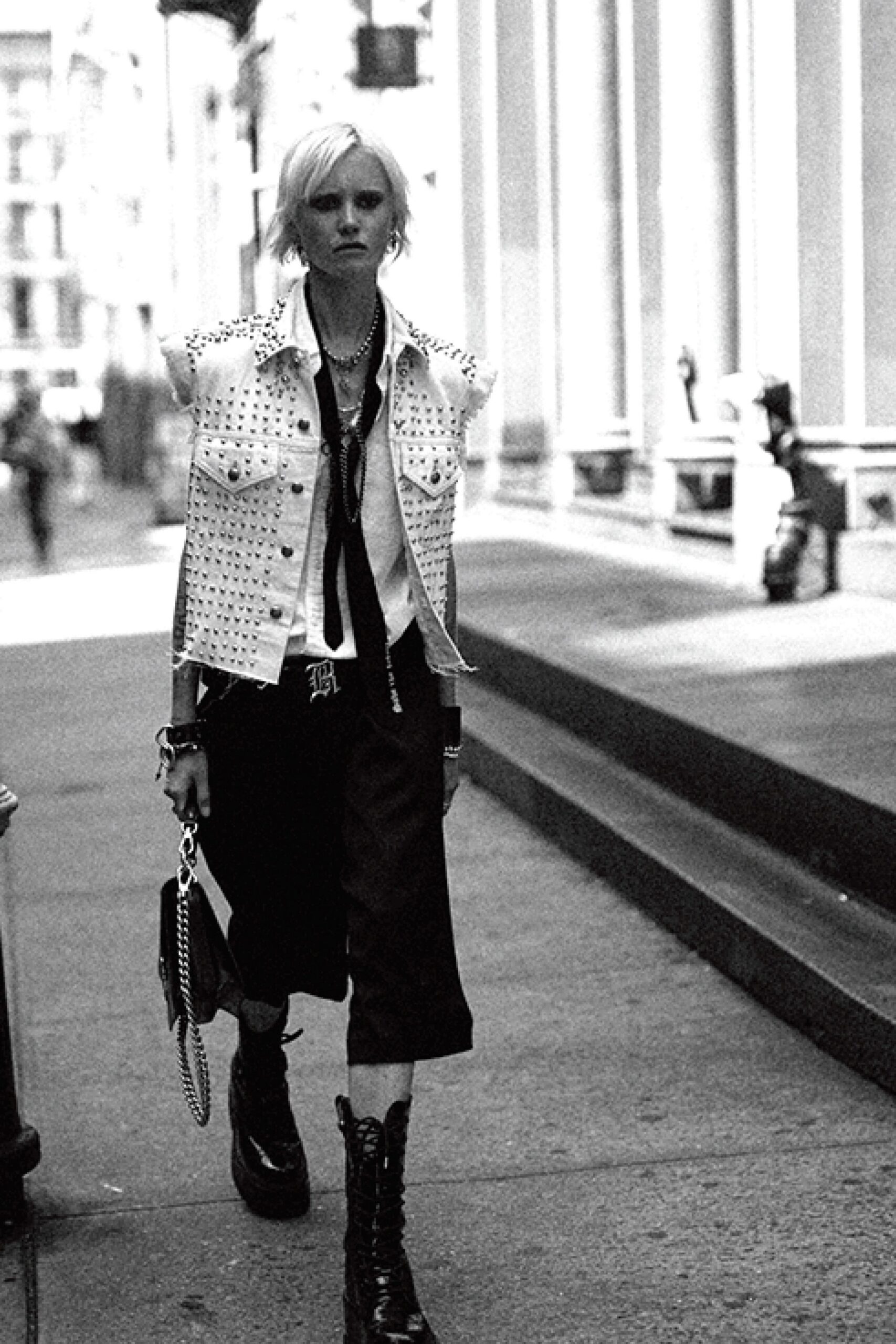 white denim sleeveless jacket with black shirt