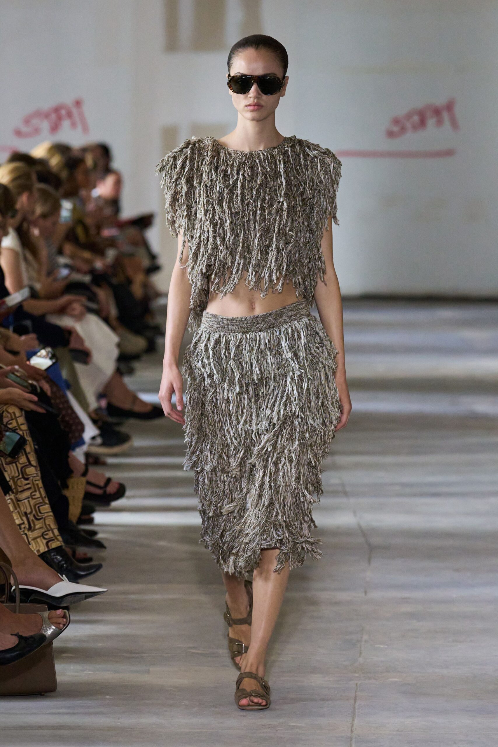 beige fringed top and skirt