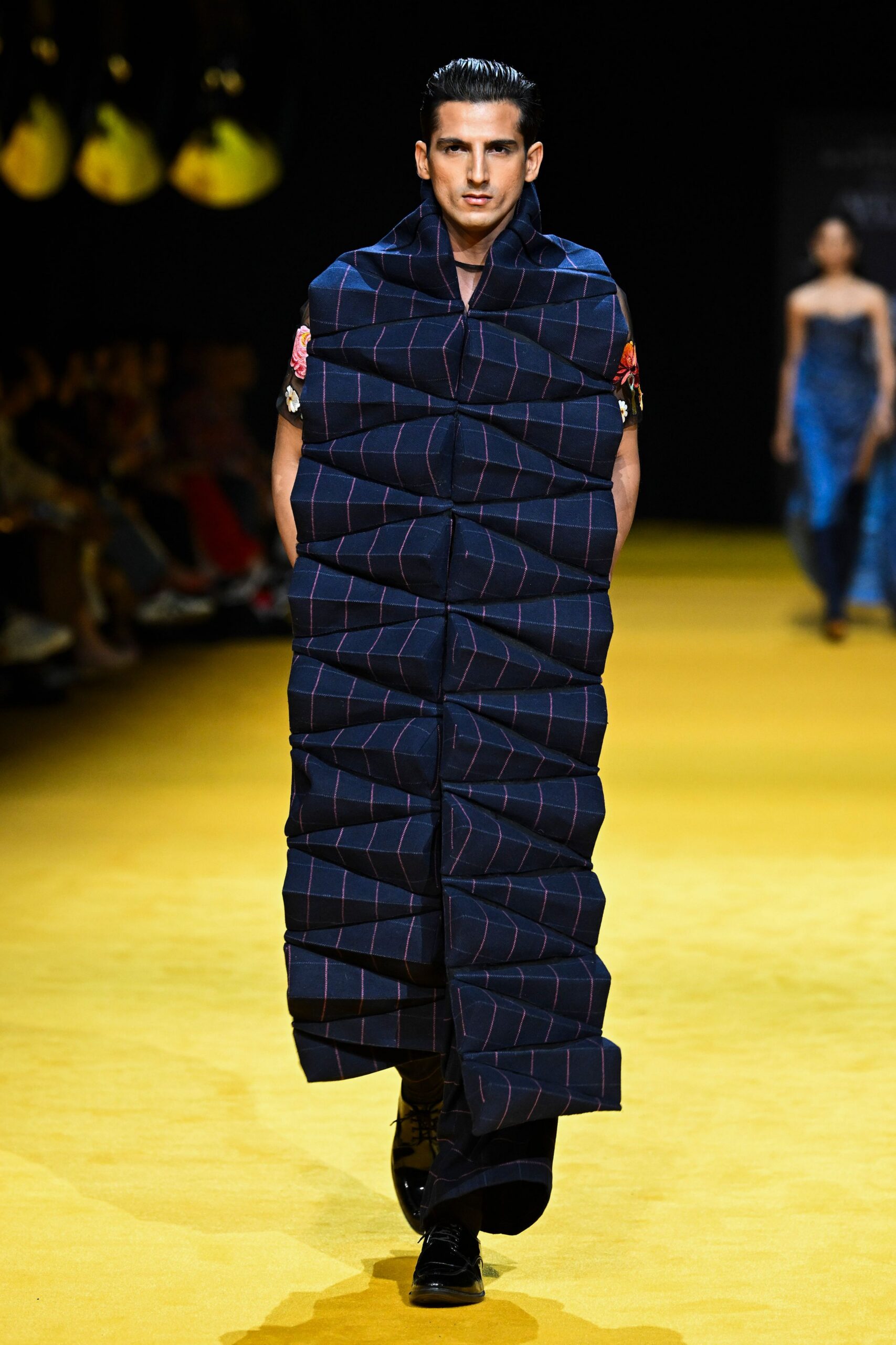 blue pleated maxi coat with black shoes