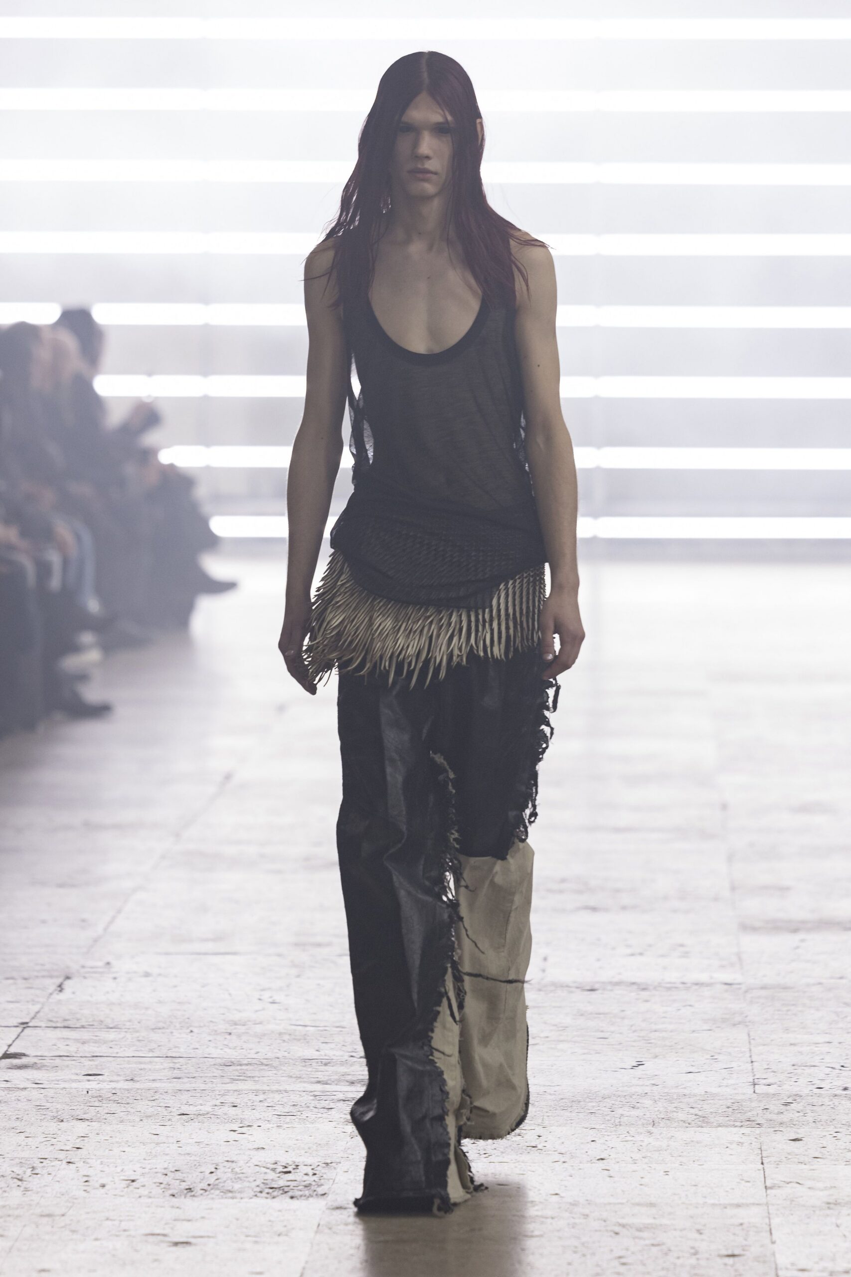 black tank-top and distressed pants