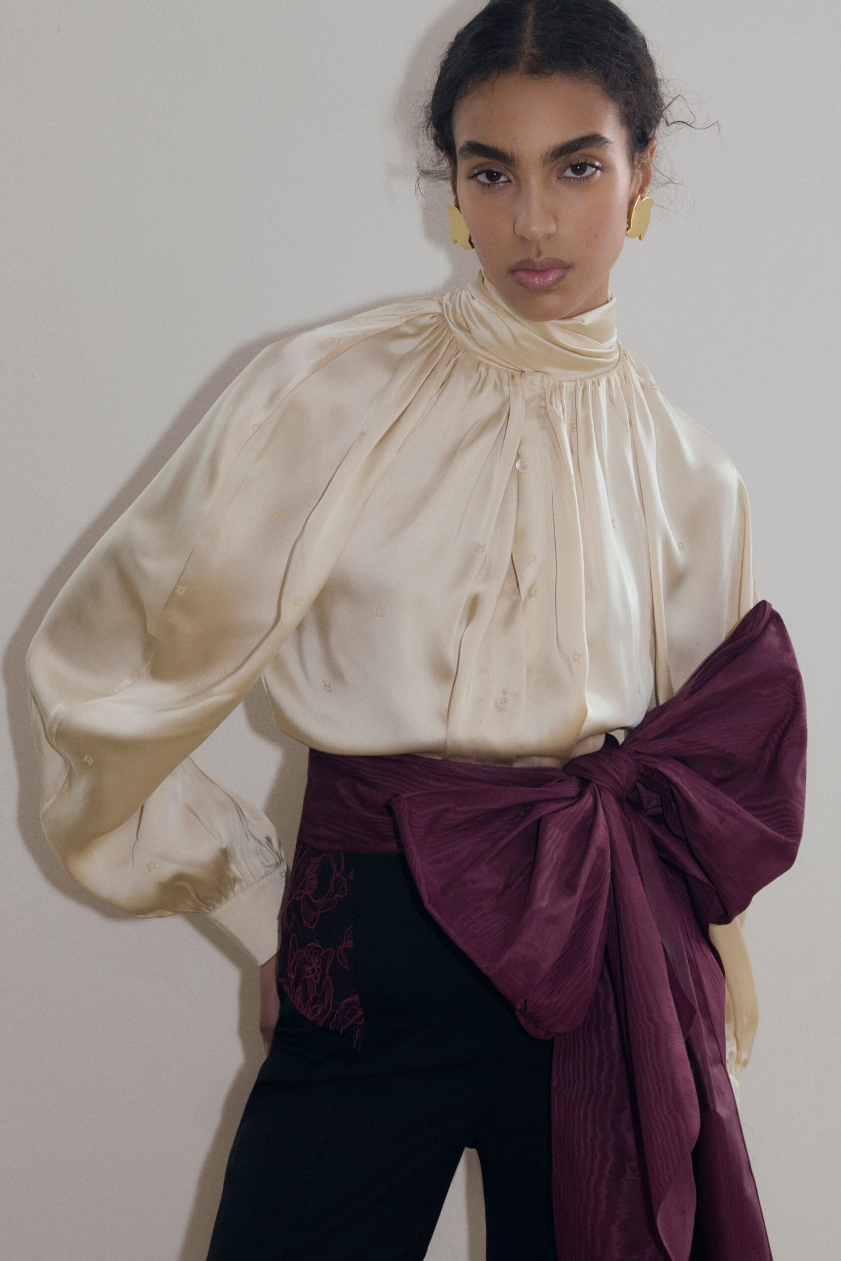 ivory silk long-sleeve high-neck relaxed pleated blouse